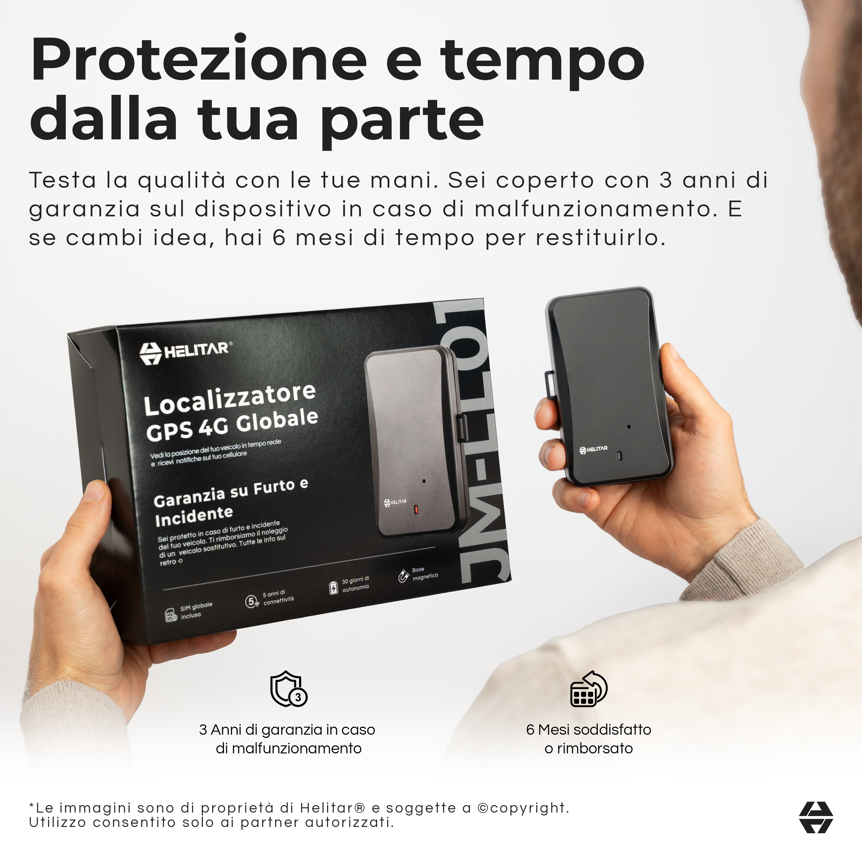 Un uomo tiene una scatola Helitar GPS 4G grigia e un dispositivo grigio.