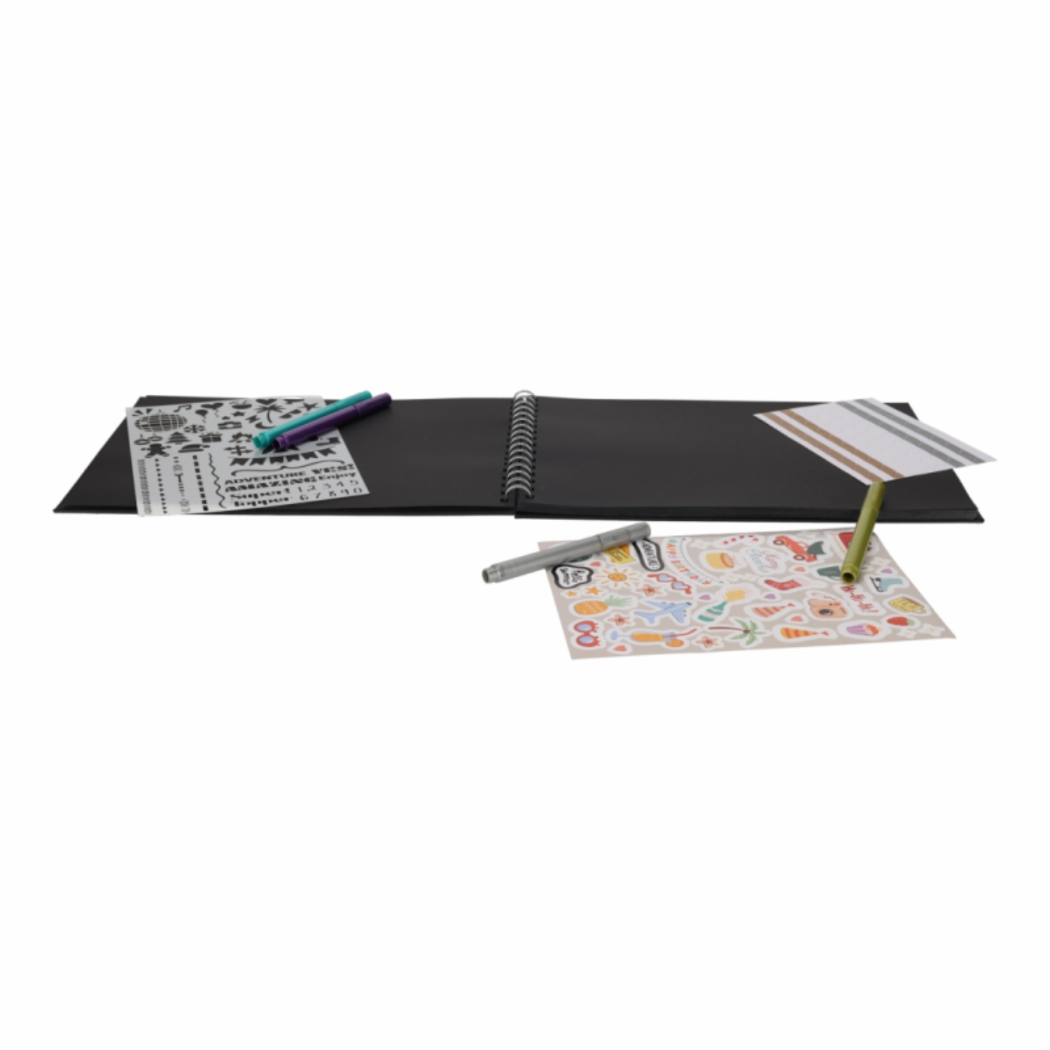 An open notebook with stencils, pens, and stickers.