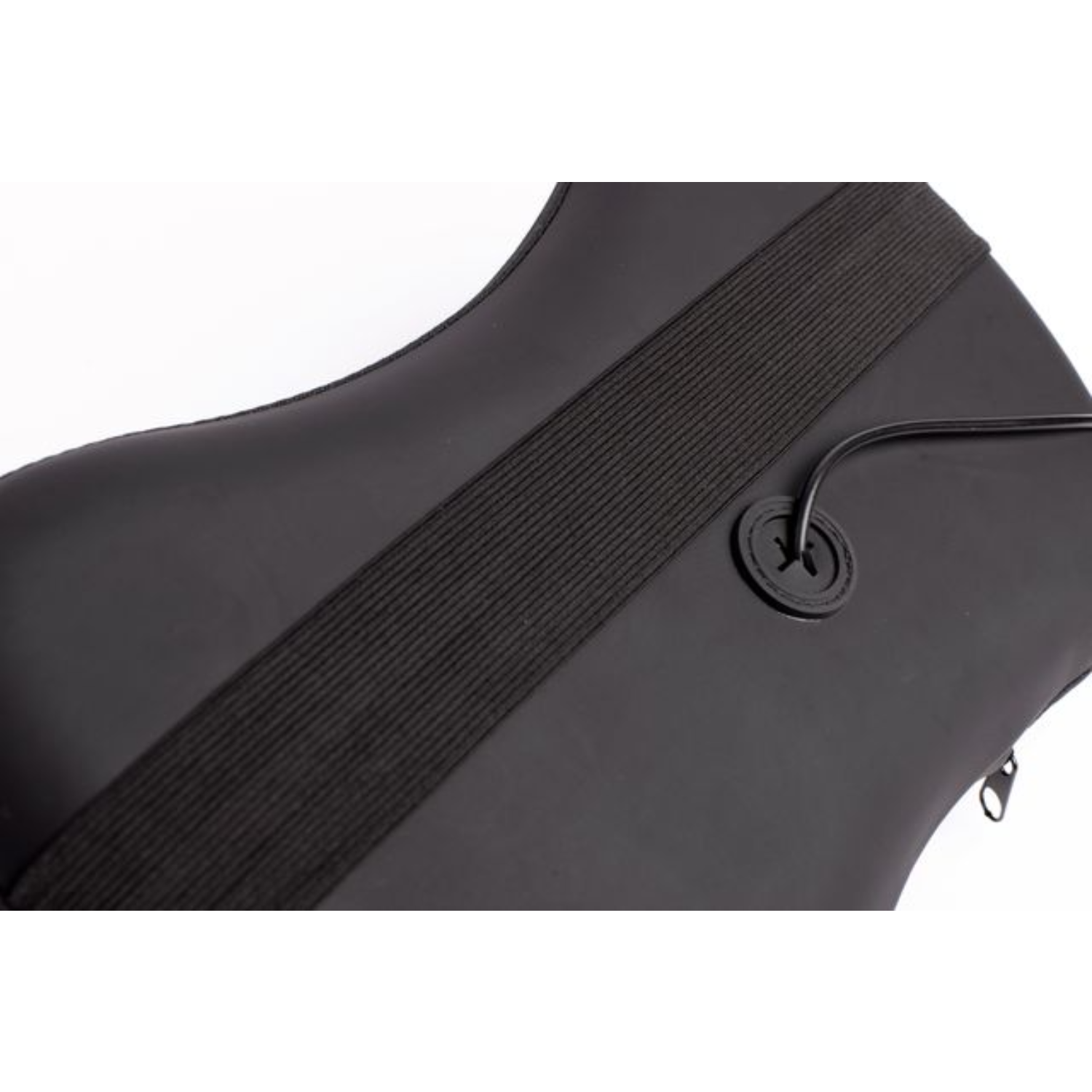 Close-up of a black boot with elastic strap and zipper detail.
