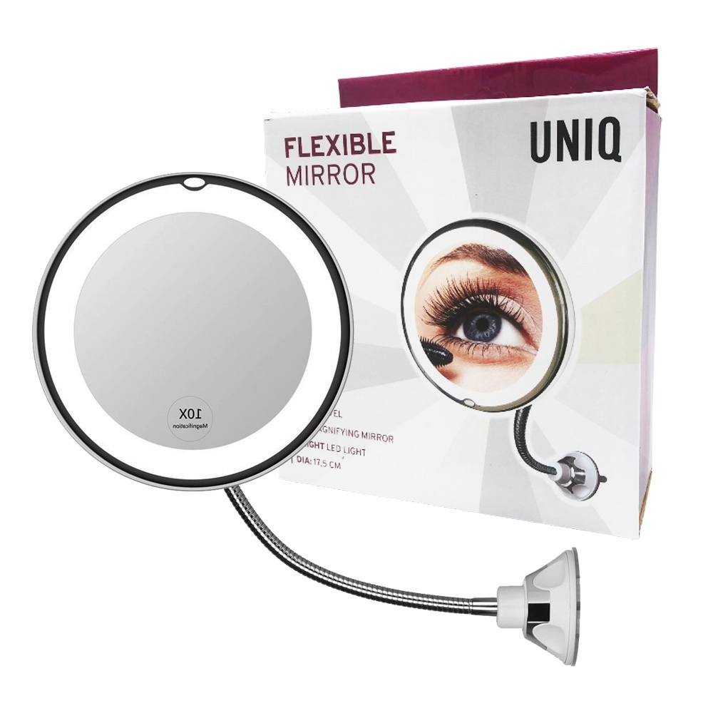 Uno specchio flessibile con luce LED e ventosa, accanto alla confezione.