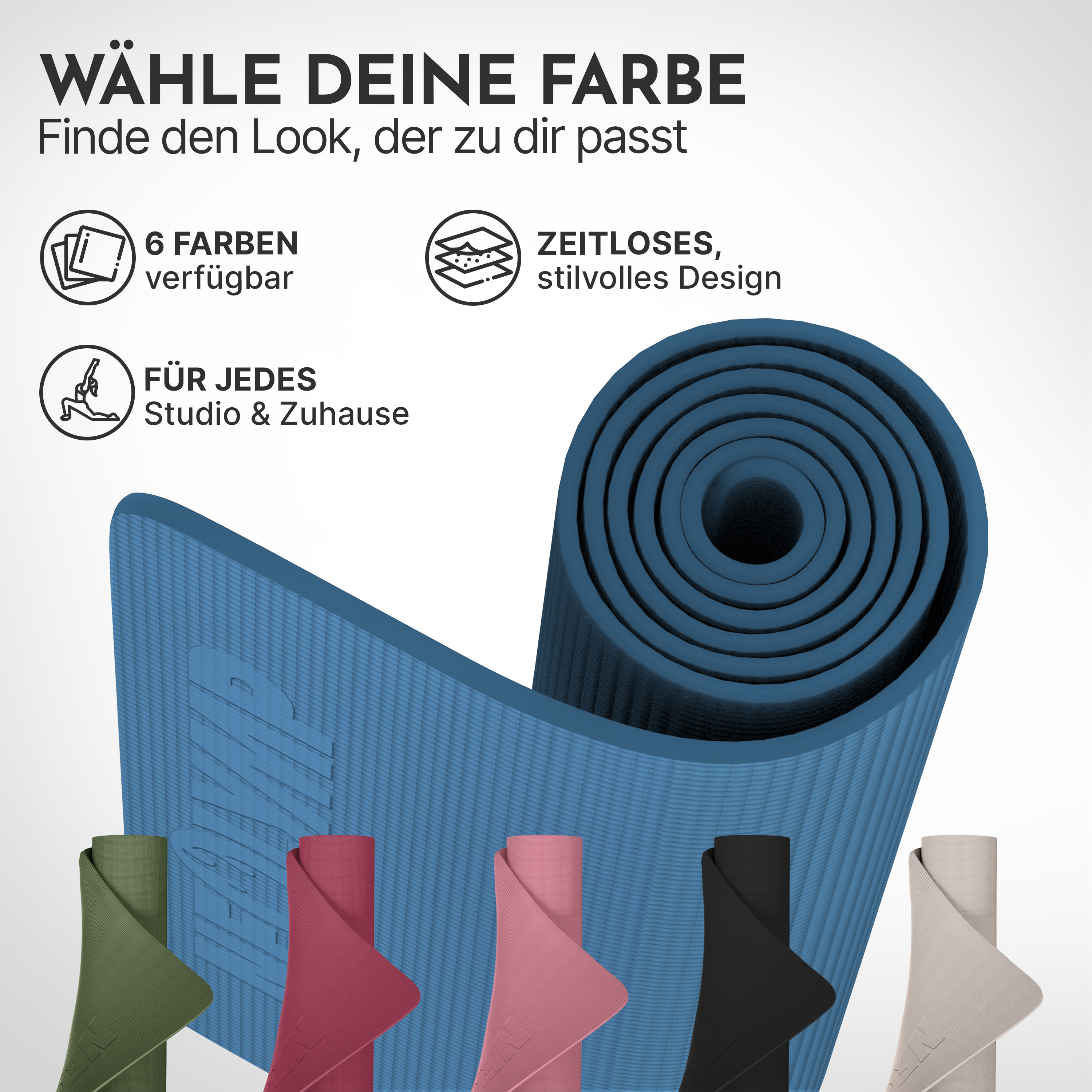 Mehrere Yogamatten in verschiedenen Farben, aufgerollt und nebeneinander.