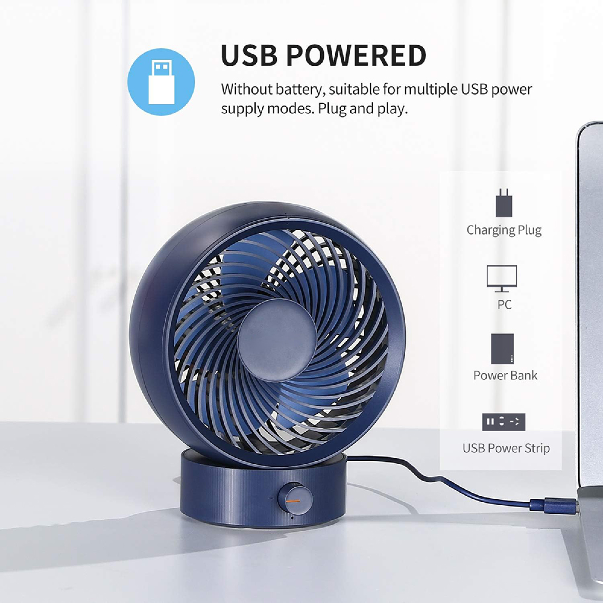 Ein blauer USB-Ventilator steht auf einem Tisch und ist an einen Laptop angeschlossen.