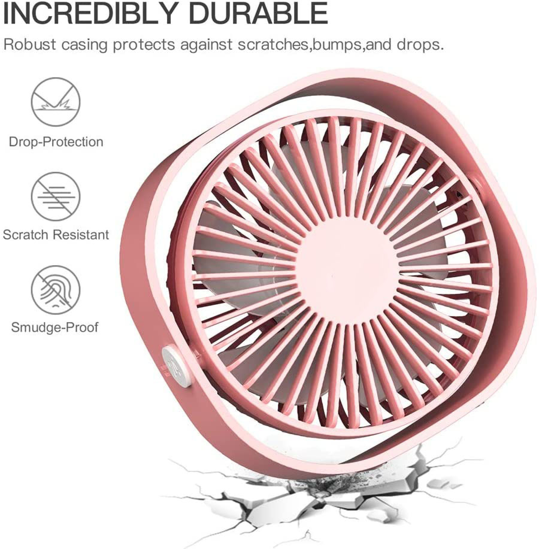 Ein rosafarbener Ventilator mit robustem Gehäuse auf zerbrochenem Boden.