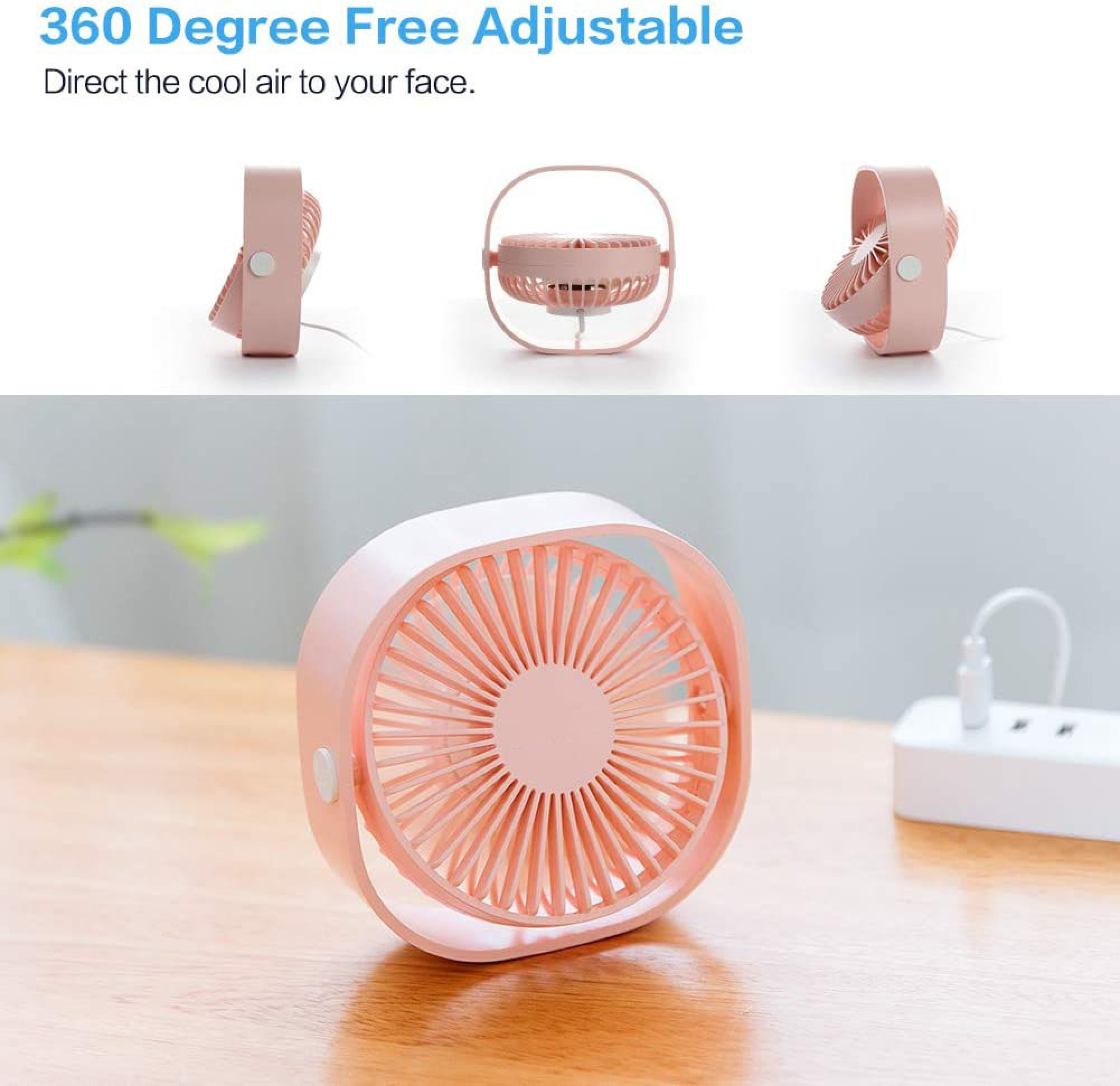 Ein kleiner rosafarbener Ventilator steht auf einem Holztisch neben einer weißen Steckdosenleiste.