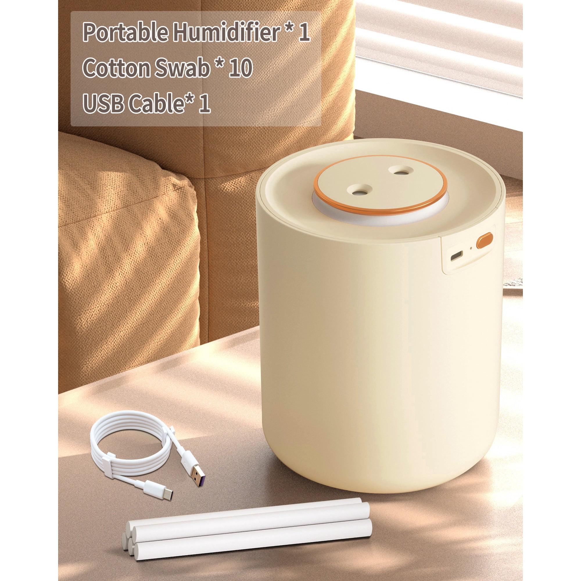 Ein cremefarbener Luftbefeuchter mit USB-Kabel und Wattestäbchen auf einer Oberfläche.