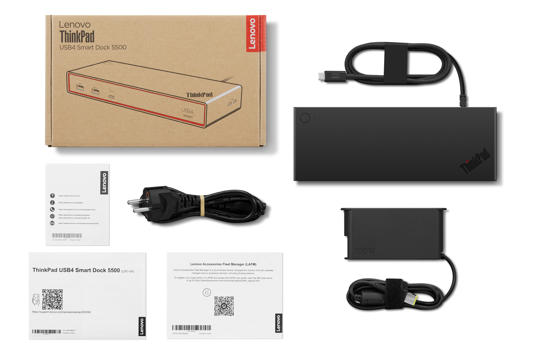 Lenovo ThinkPad USB4 Dock, Netzteil, Kabel und Anleitungen auf schwarzem Hintergrund.