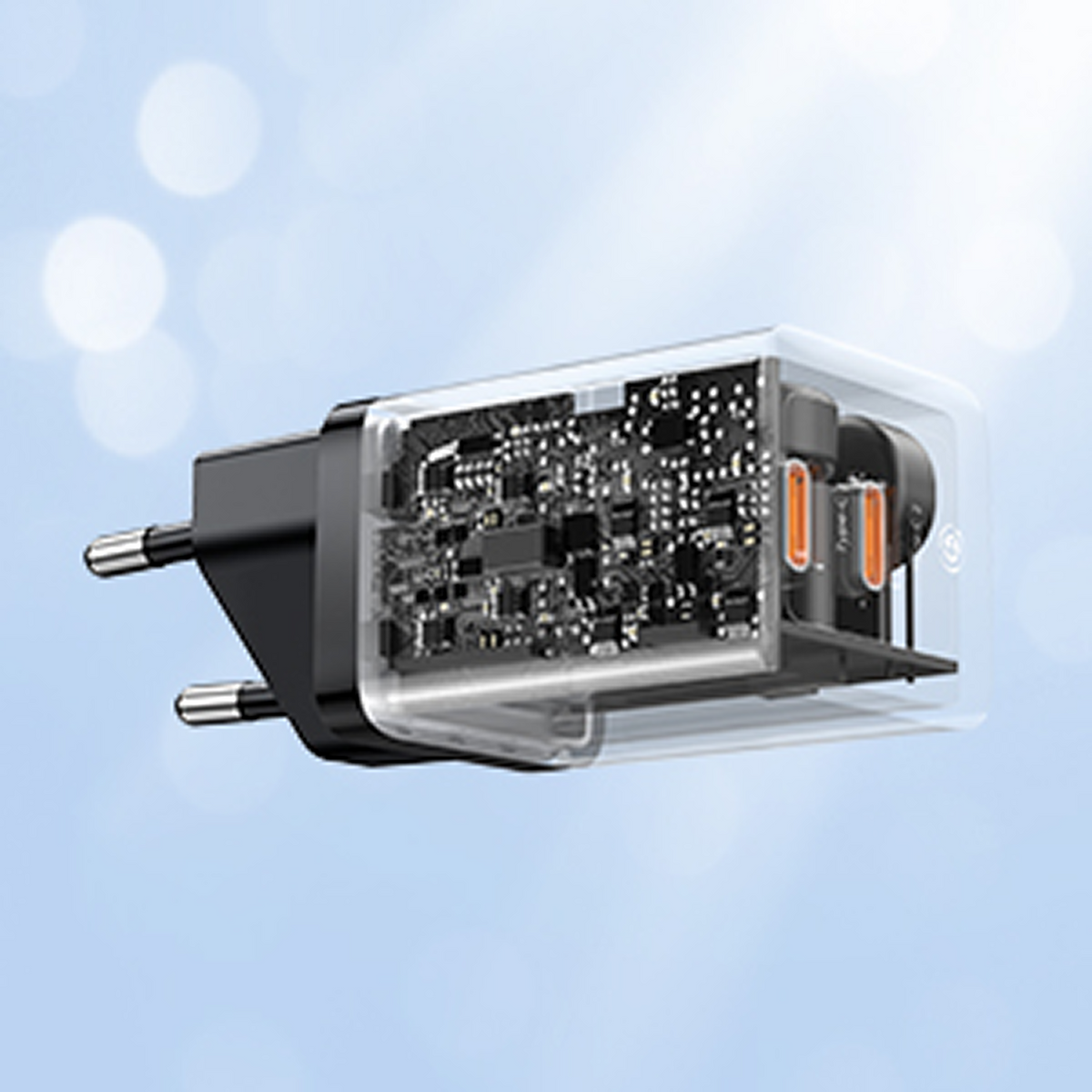 İç devreyi ve iki USB-C bağlantı noktasını gösteren şeffaf güç adaptörü.