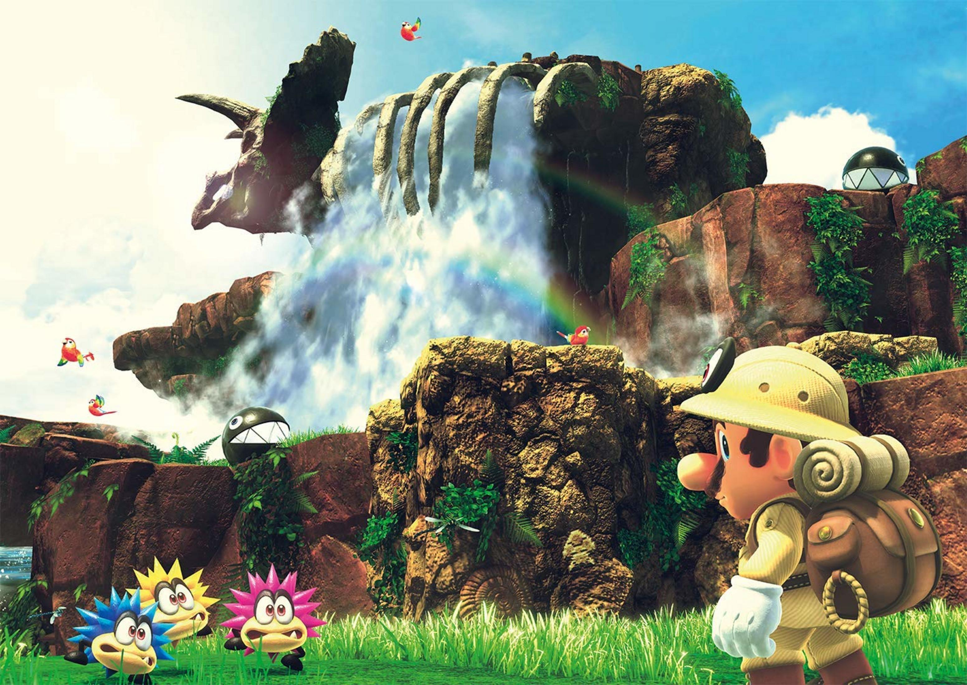 Mario in Safari-Kleidung steht vor einem Wasserfall auf einer felsigen Insel mit Dino-Schädel-Struktur.