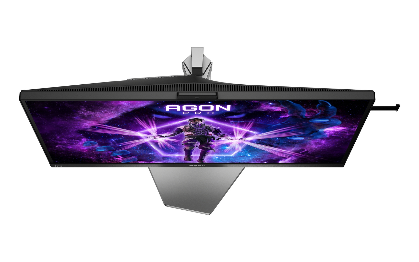 Un monitor gaming con un astronauta sobre fondo espacial morado.