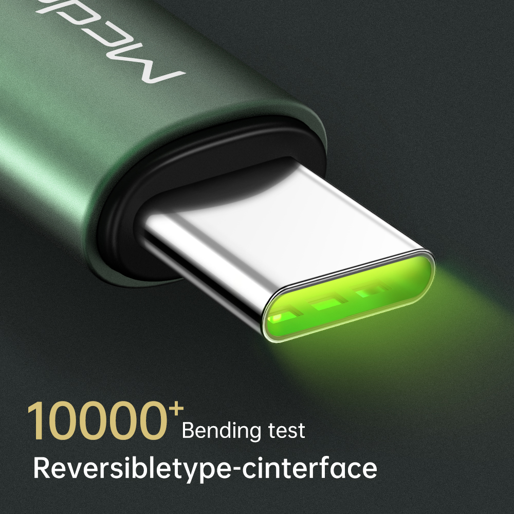 Parlayan yeşil iç kısımlı yeşil USB-C konektör. Metin: 10000+ Bükülme testi, Ters çevrilebilir c tipi arayüz.