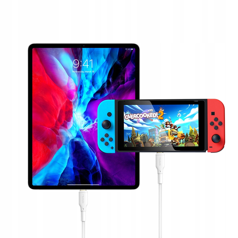 Renkli duvar kağıdı gösteren bir tablet, ona bağlı Nintendo Switch ile Overcooked 2 oynuyor.