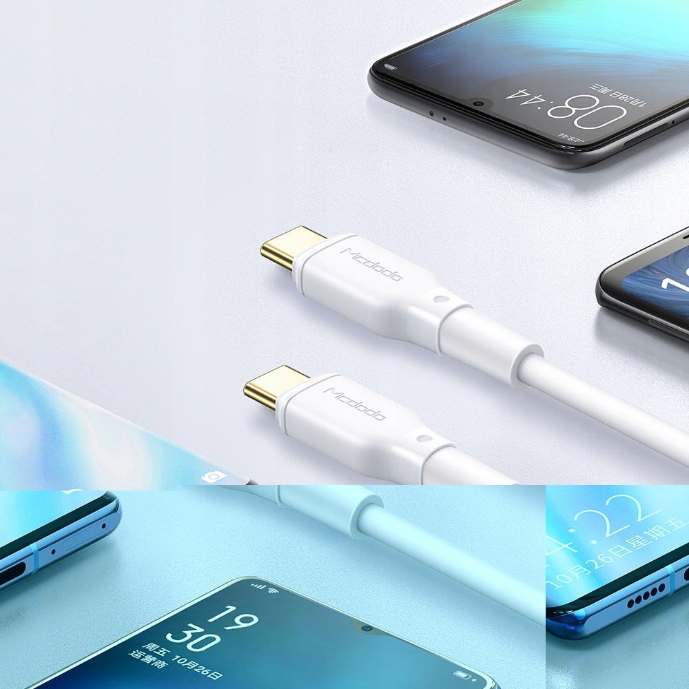 Zaman gösteren akıllı telefonların yanında iki beyaz USB-C kablosu.