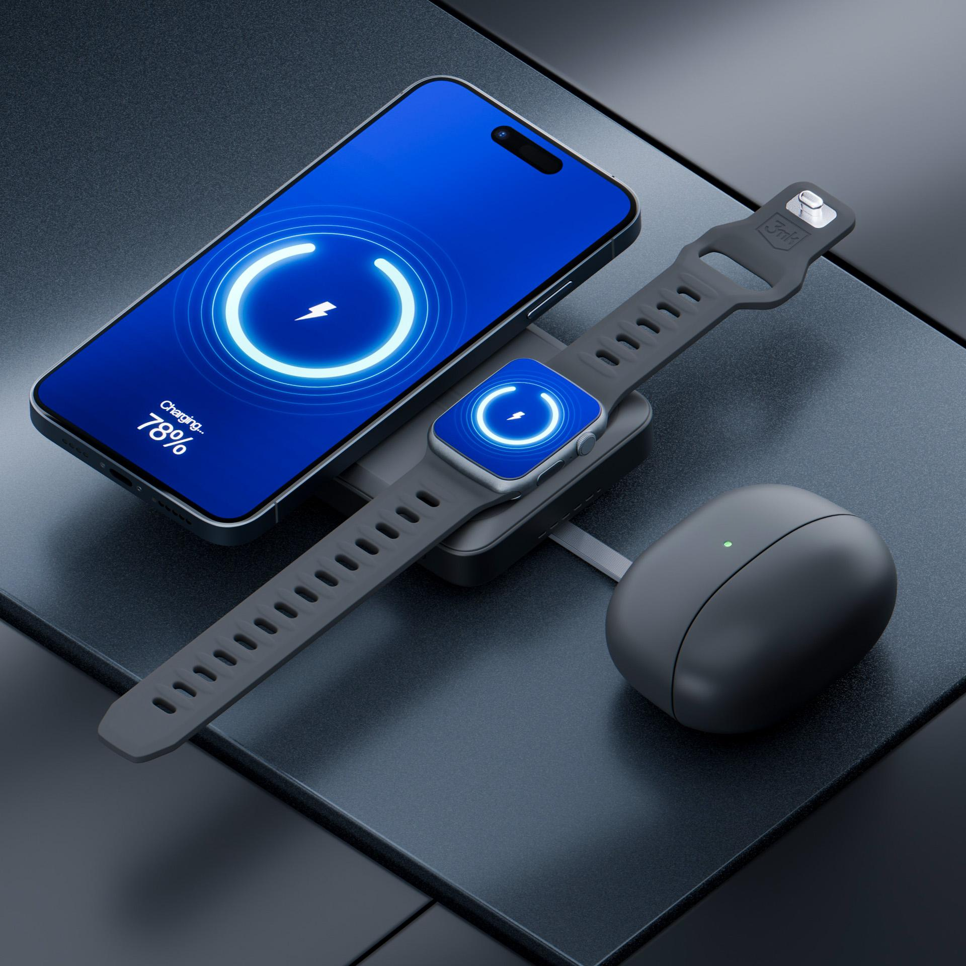 Smartfon, smartwatch i słuchawki ładujące się na podkładce ładującej.