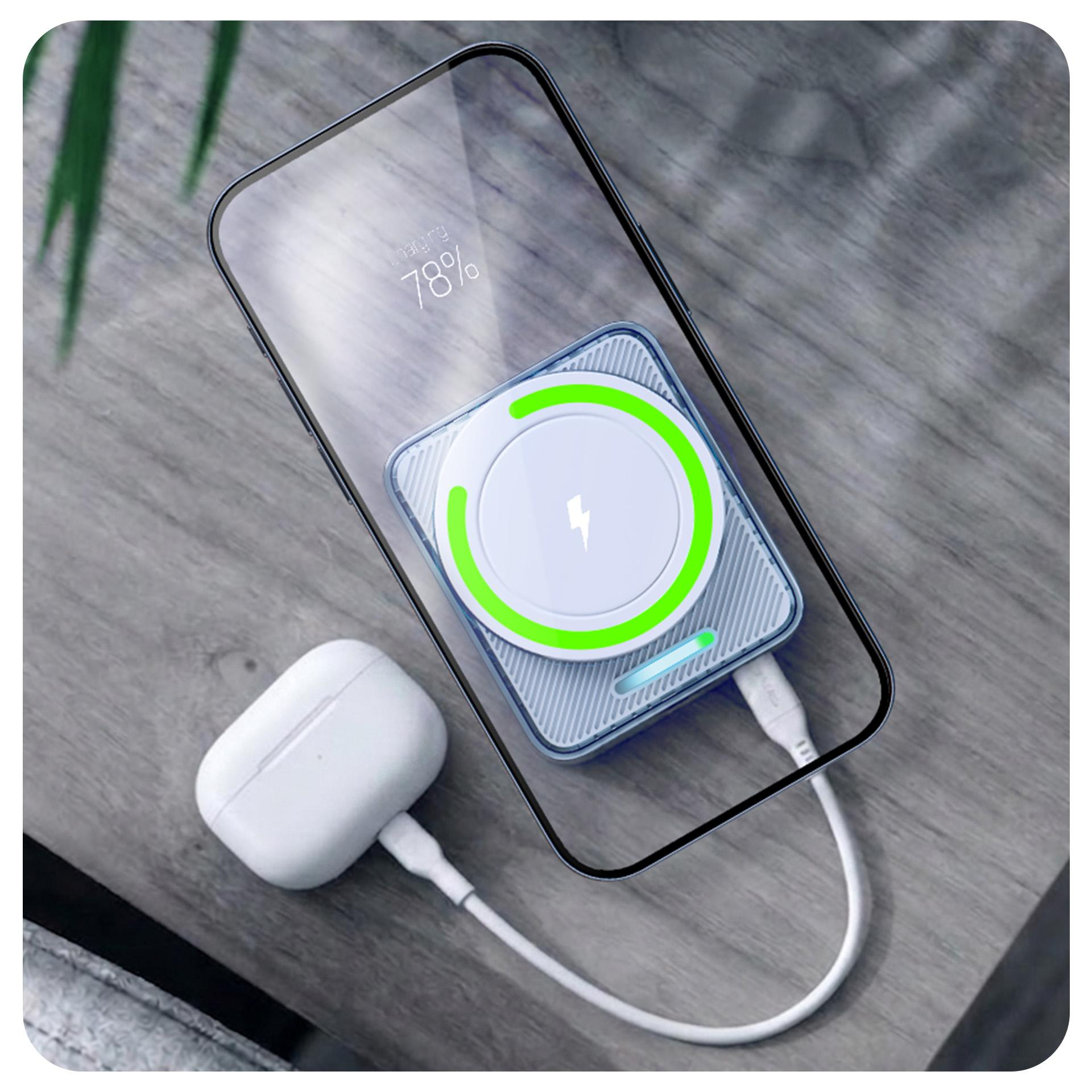 Smartfon ładuje się bezprzewodowo na podkładce, obok słuchawki.