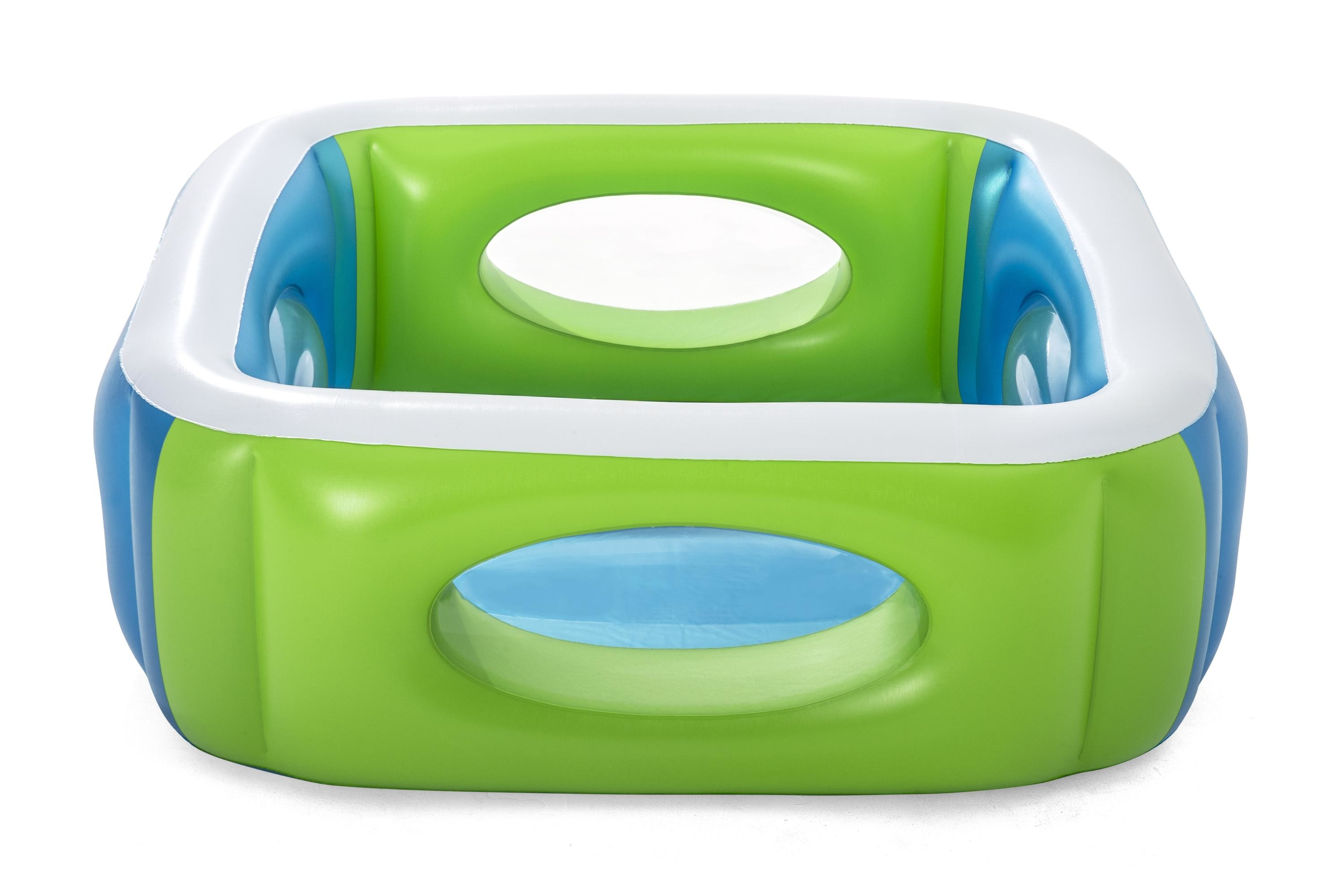 Una piscina inflable en verde, azul y blanco con ventanas.