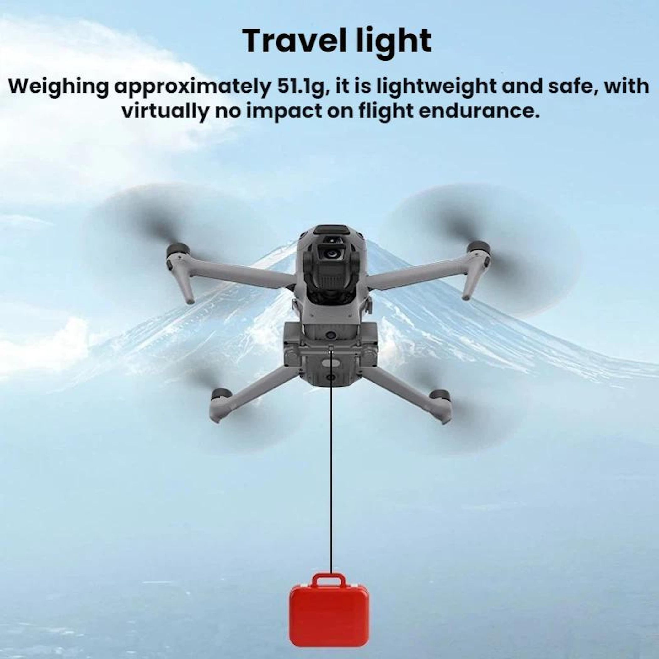 Drone con valigia rossa su sfondo montuoso.