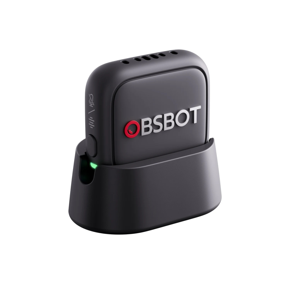 Ein schwarzer OBSBOT-Tracker mit Ladehalterung und grüner LED.