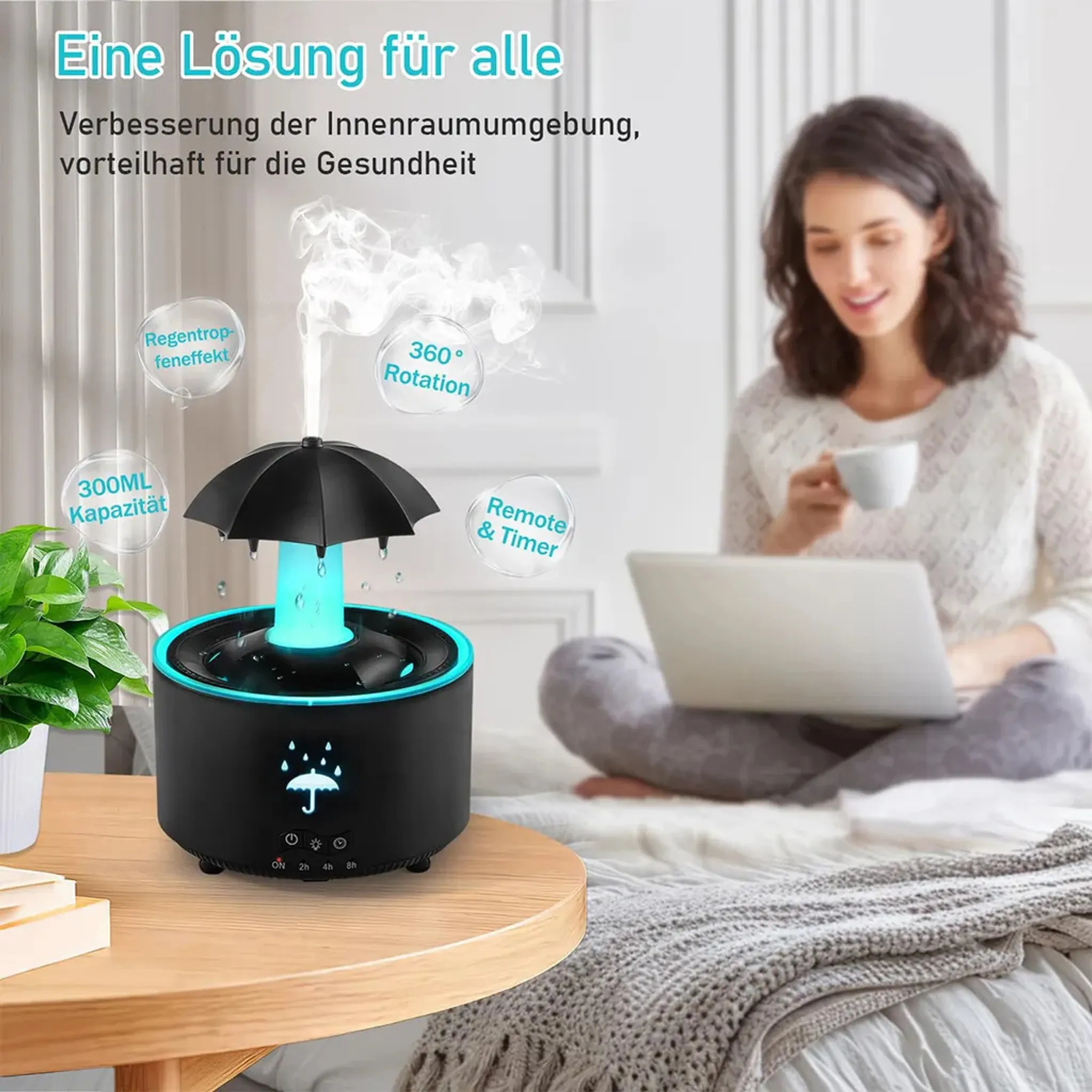 Ein Diffusor mit Regenschirm-Design gibt Dampf ab. Eine Frau sitzt im Hintergrund.