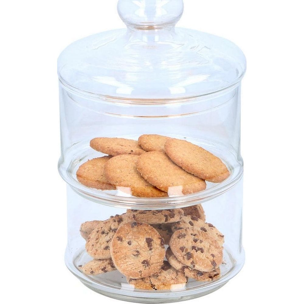Two-tier glass cookie jar filled with biscuits and chocolate chip cookies.