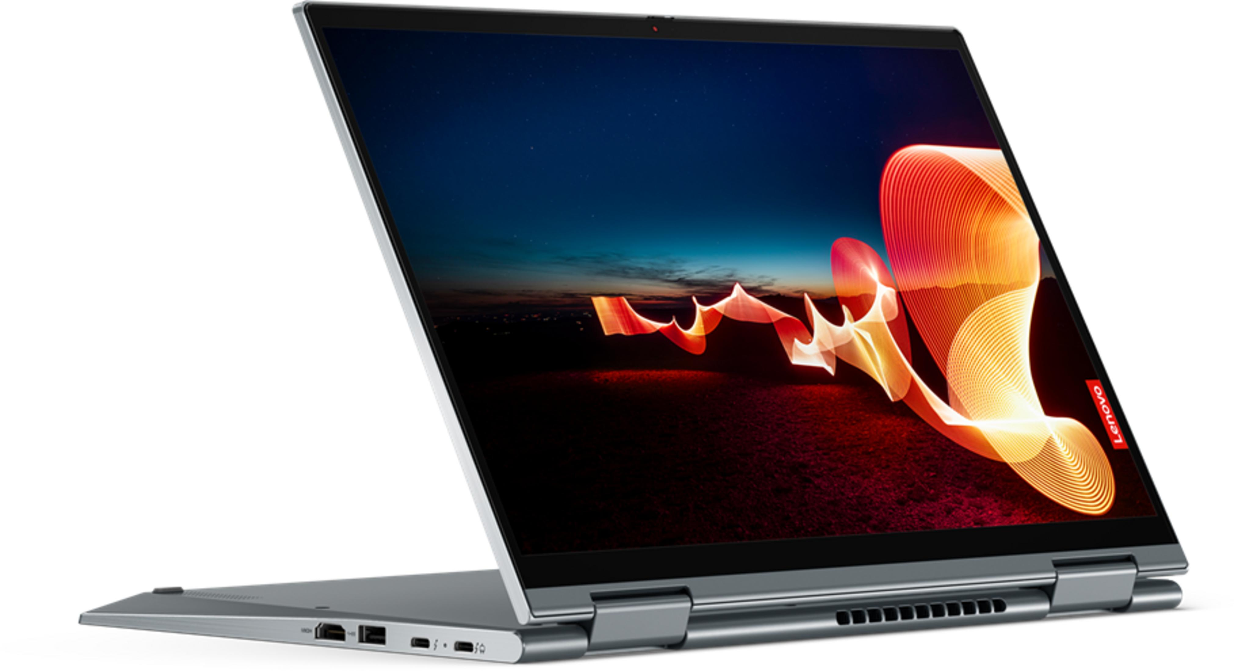 Ein silberner Laptop ist geöffnet und zeigt einen dunklen Himmel mit Lichtspuren.