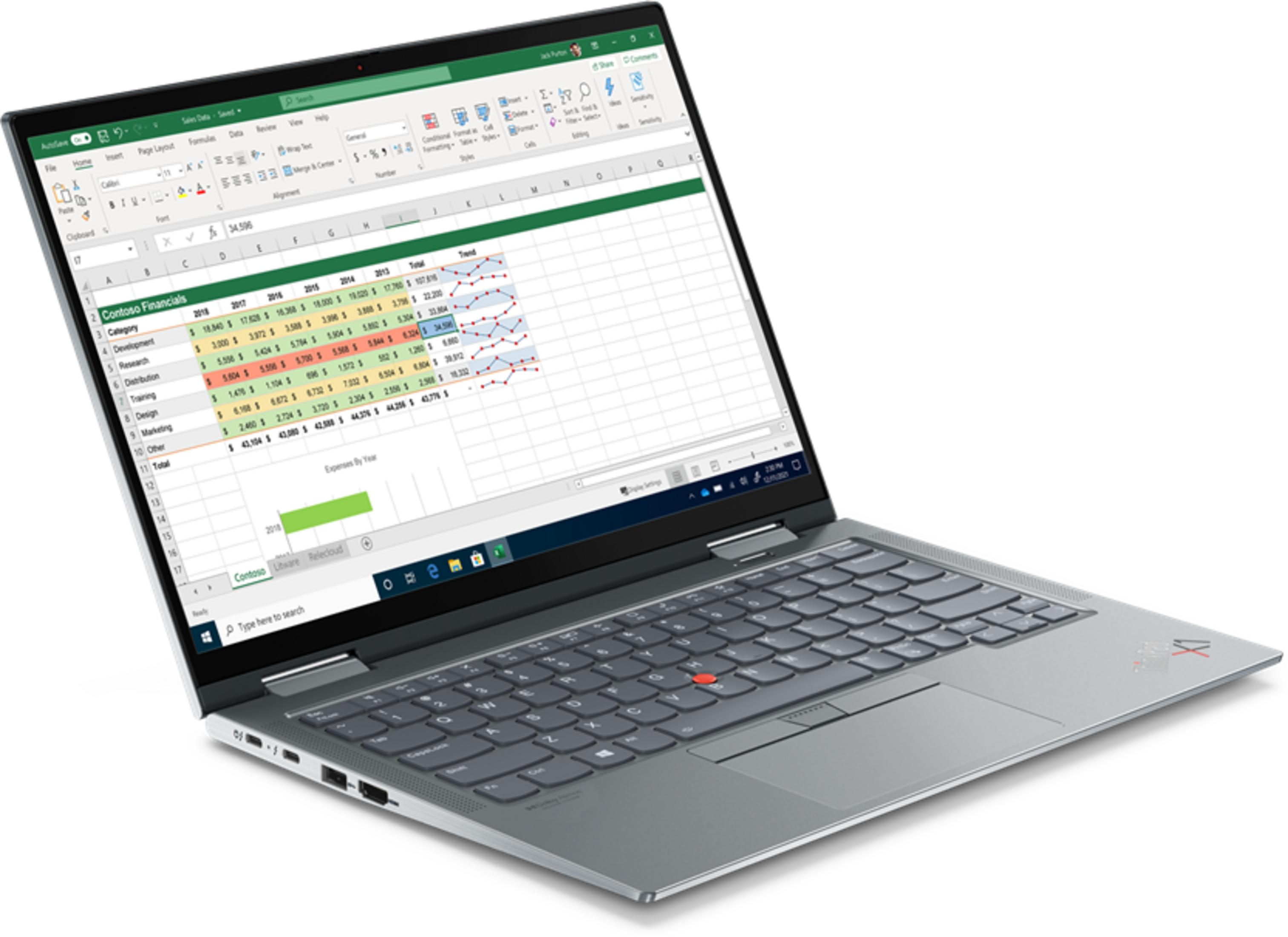 Ein silberner Laptop mit einem Excel-Tabellenkalkulationsdiagramm auf dem Bildschirm.