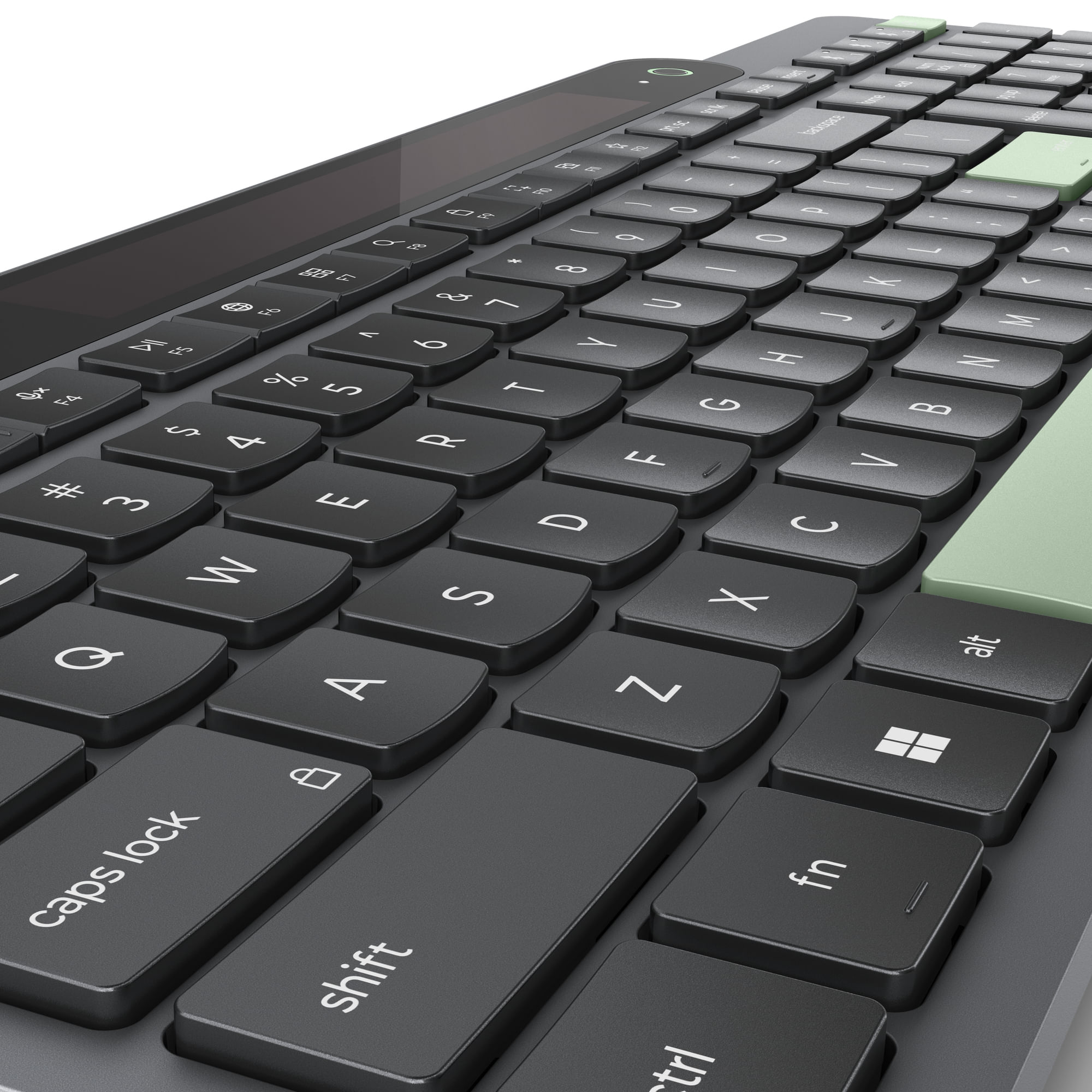 Primer plano de un teclado oscuro con teclas de acento verde claro. Las teclas están etiquetadas.
