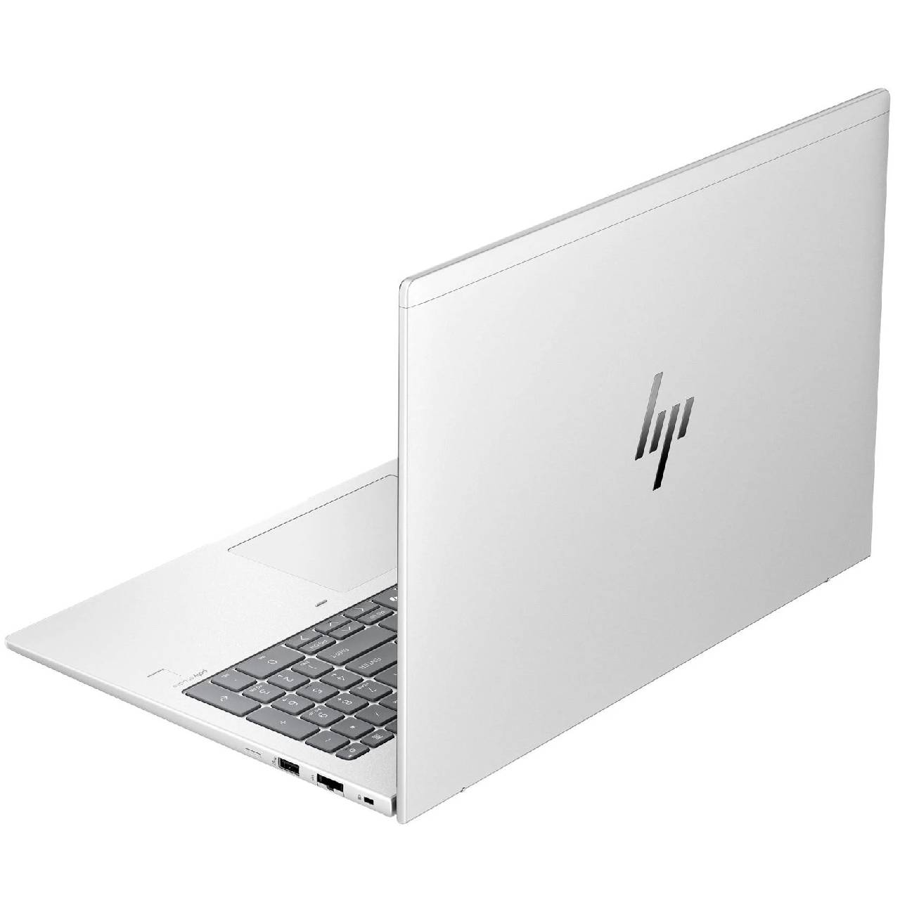 Gümüş logolu, arkadan aydınlatmalı klavyeli beyaz HP dizüstü bilgisayar.