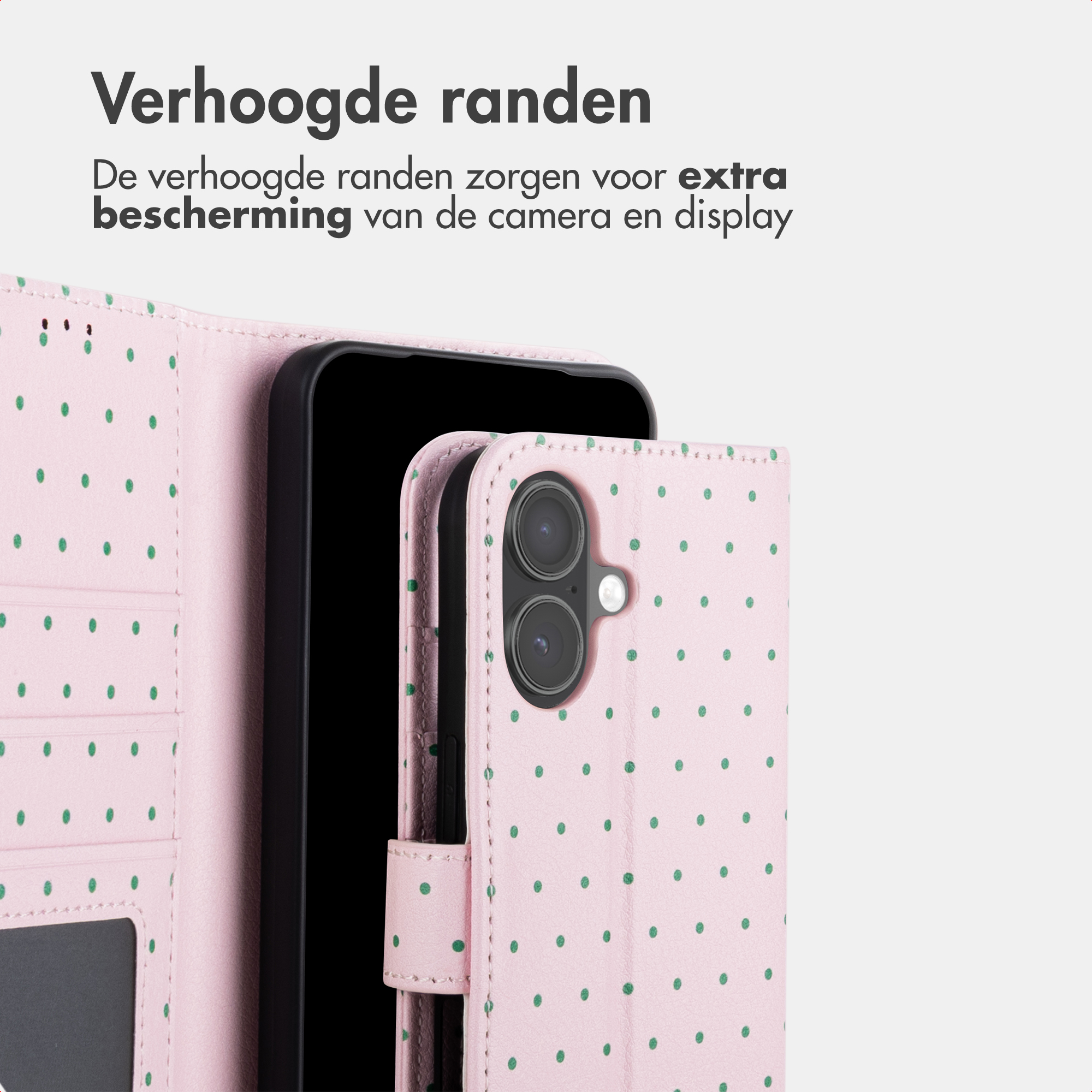 Ein rosa Handyhülle mit grünen Punkten, die eine Kamera schützt.