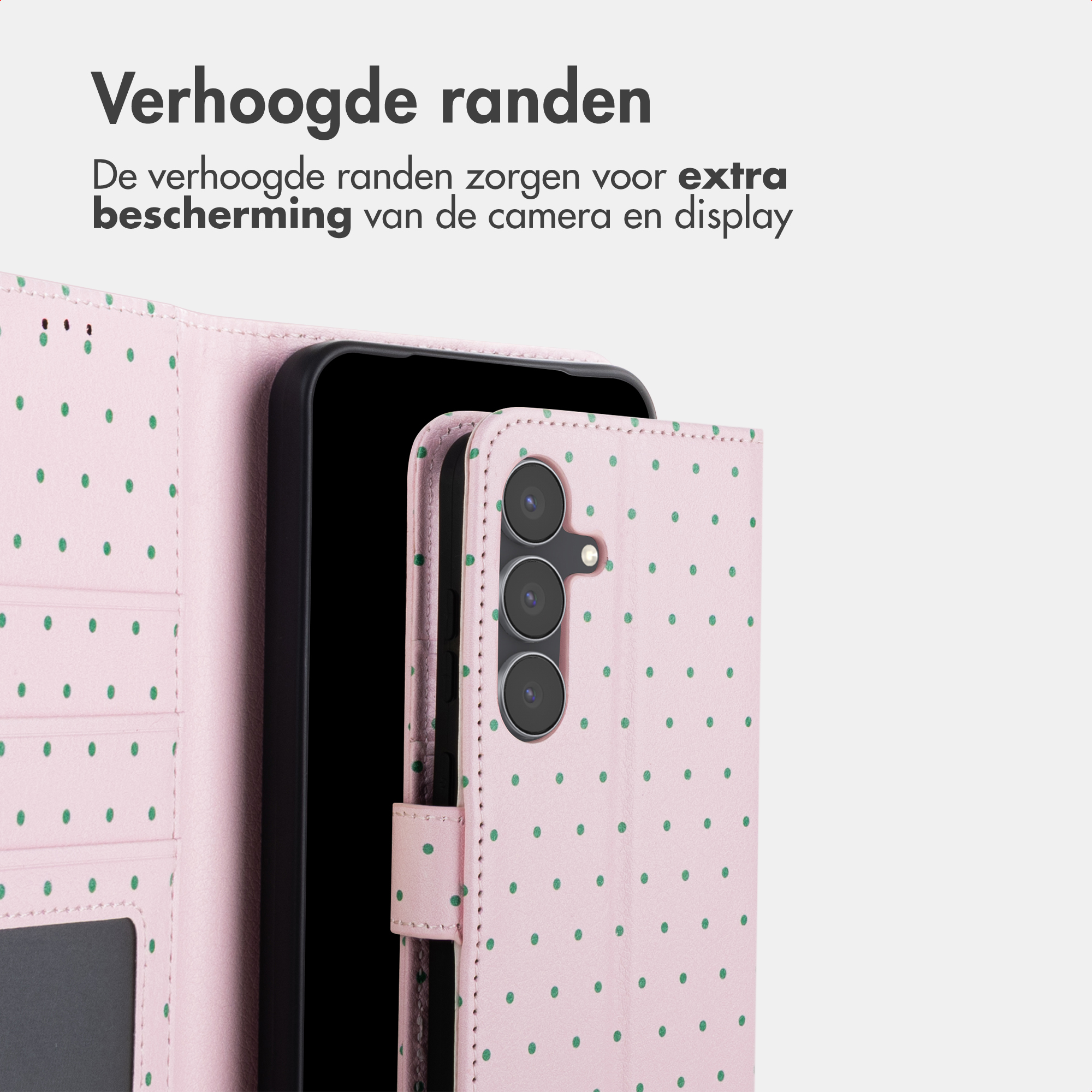 A pink phone case with green polka dots and camera housing.