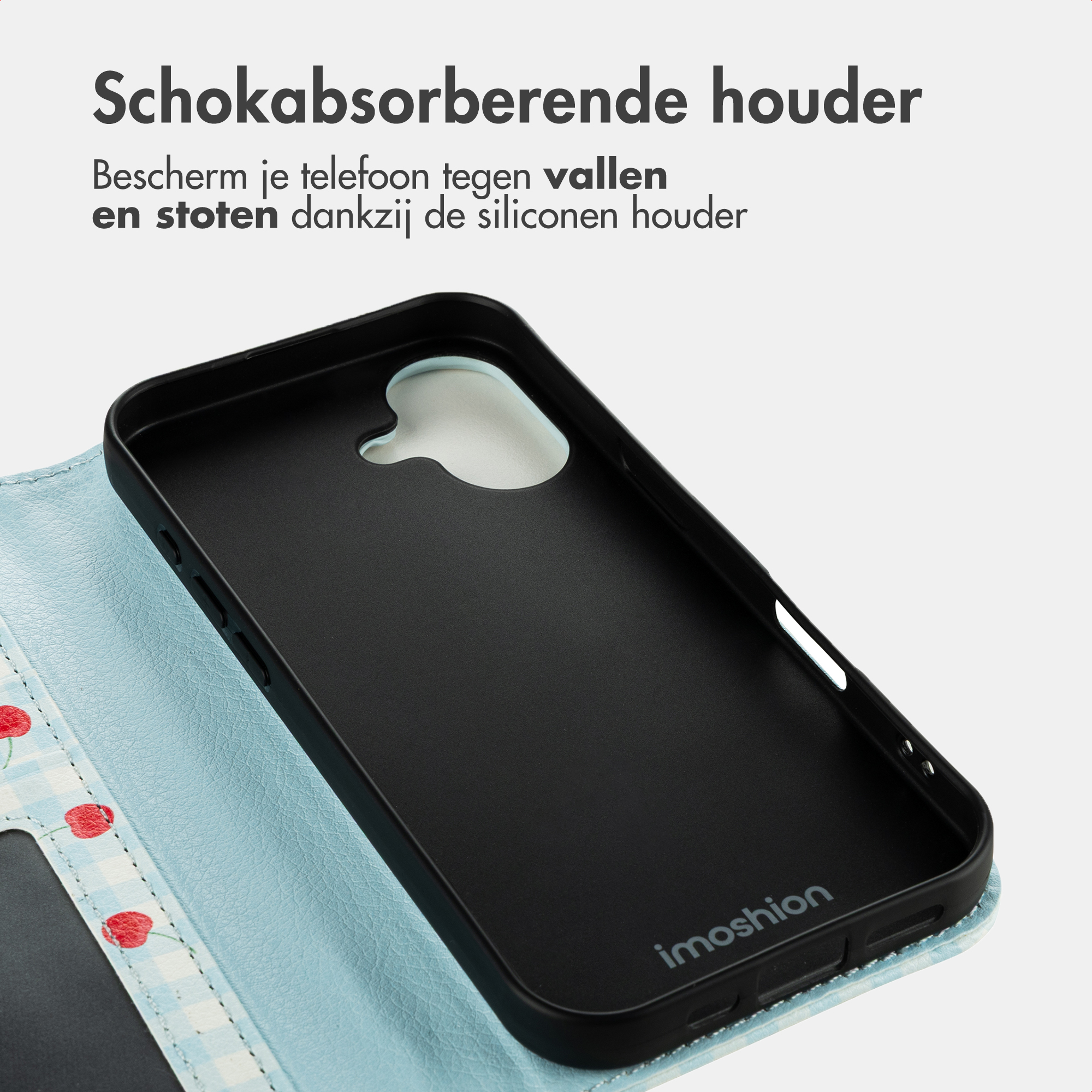 Schwarze Handyhülle mit Kirschmuster auf hellblauem Hintergrund.