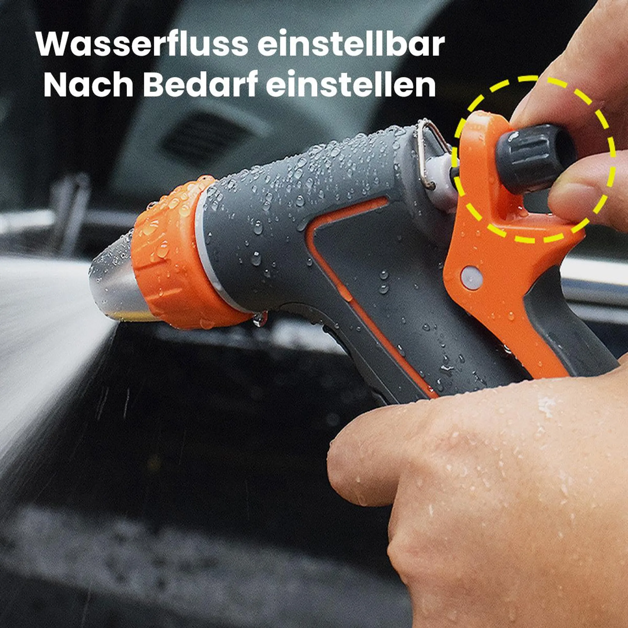 Eine Hand dreht einen Einstellknopf an einer Spritzpistole, aus der Wasser spritzt.