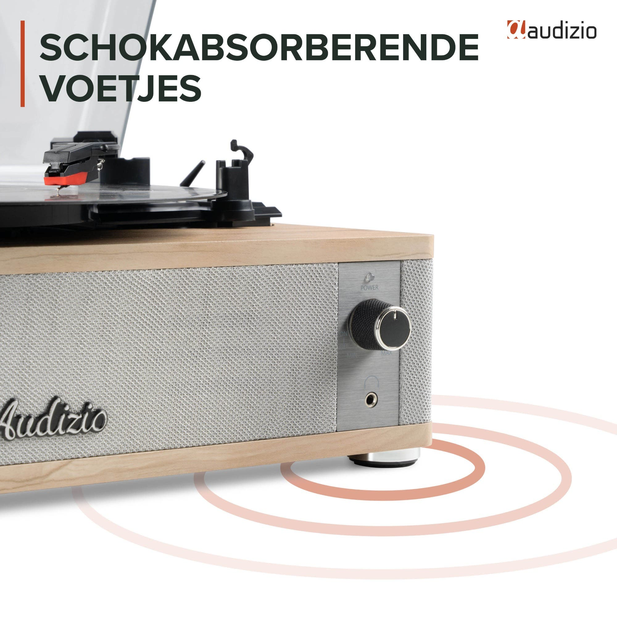 Un tocadiscos con detalles de madera y altavoces de tela descansa sobre pies amortiguadores.