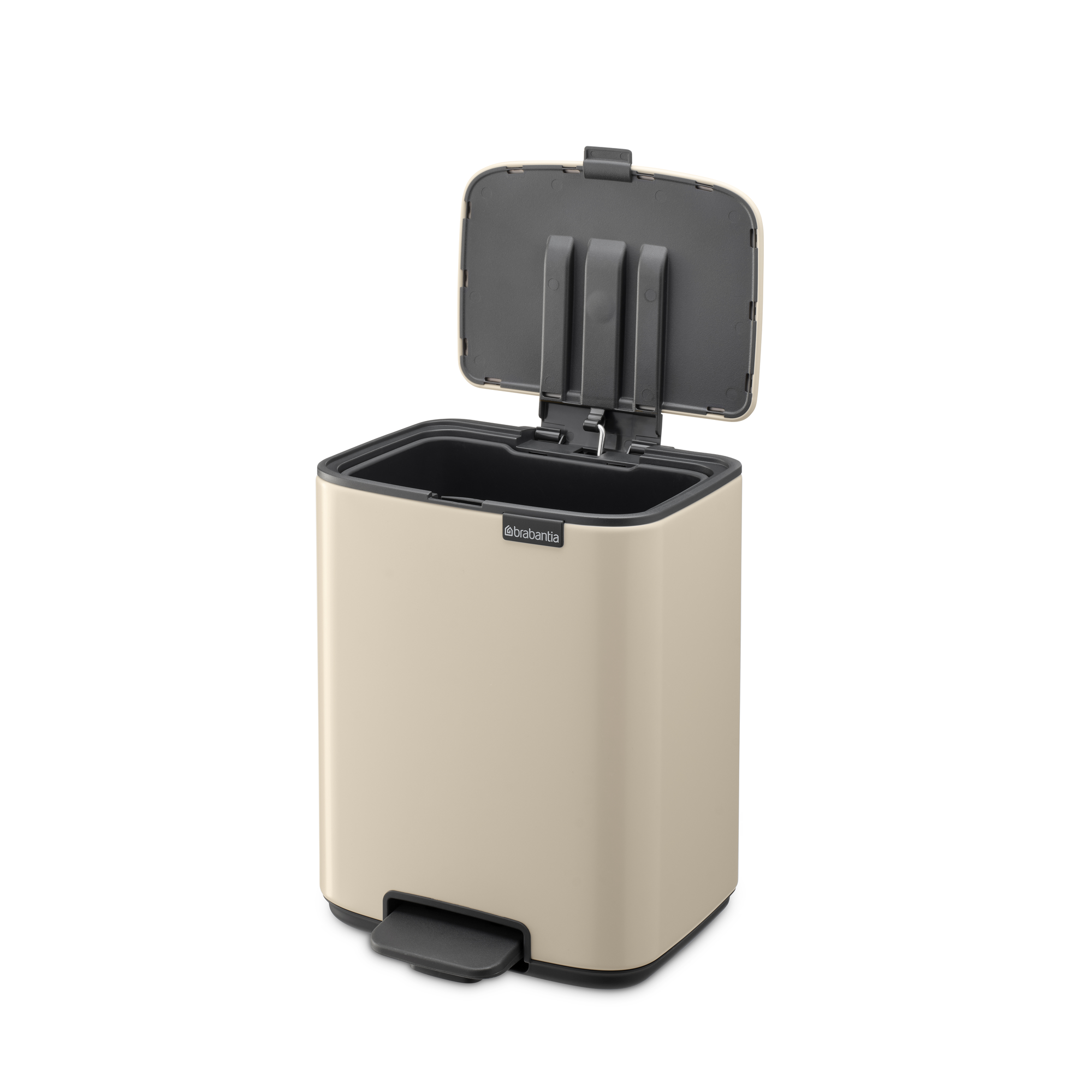 Beige pedaalemmer met open donker deksel en zwart voetpedaal.