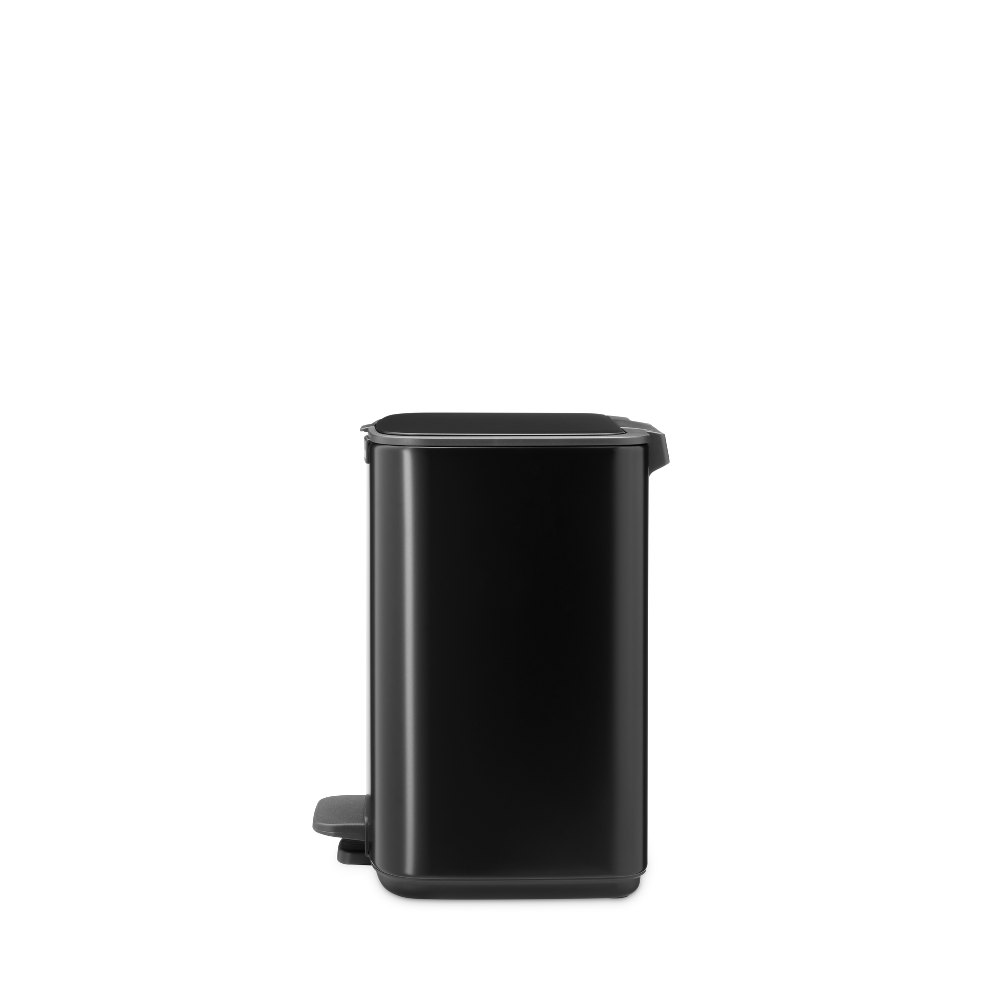 Black pedal bin with silver lid and handle, against a white background.