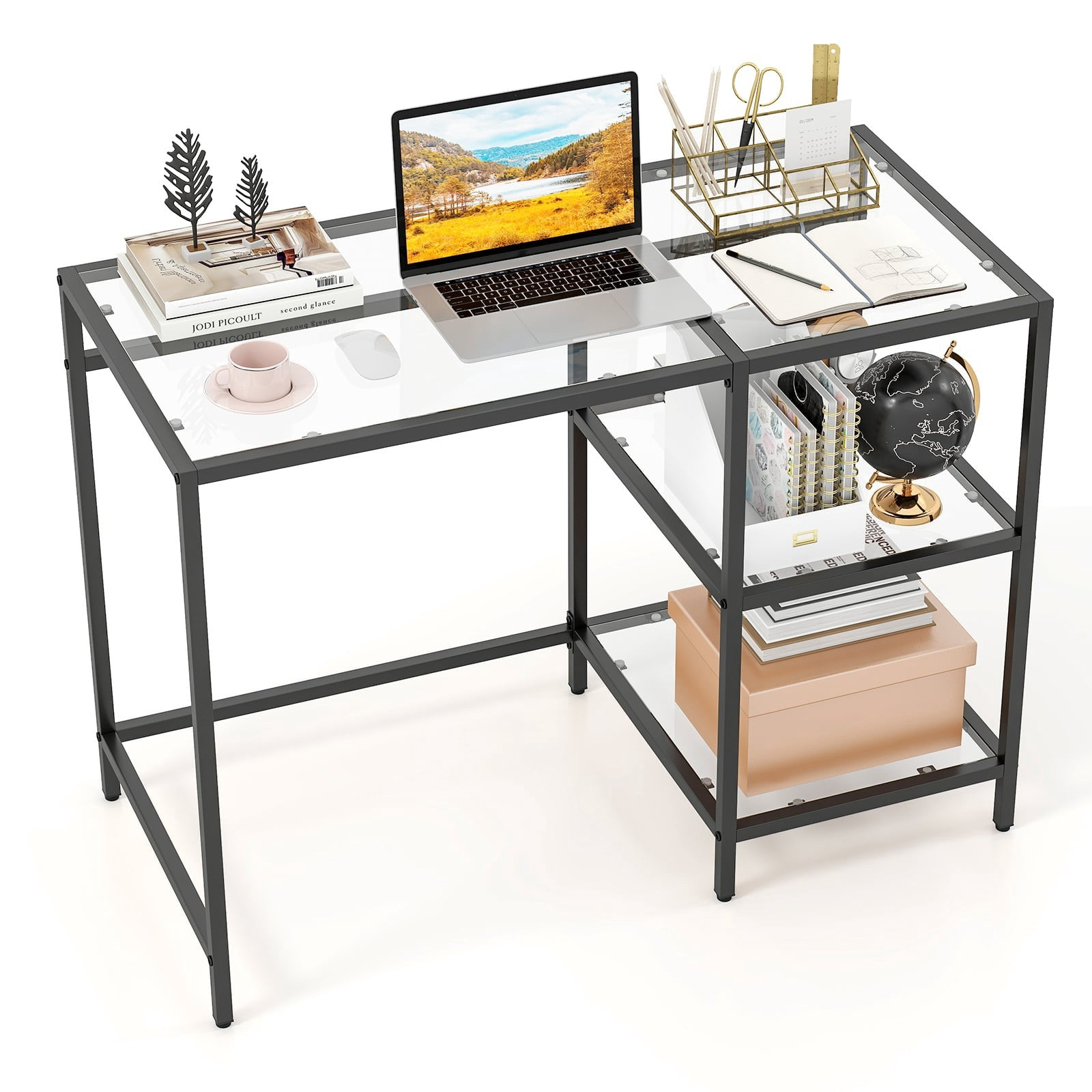 Een moderne glazen bureau met zwart metalen frame, met laptop, boeken en een kopje.