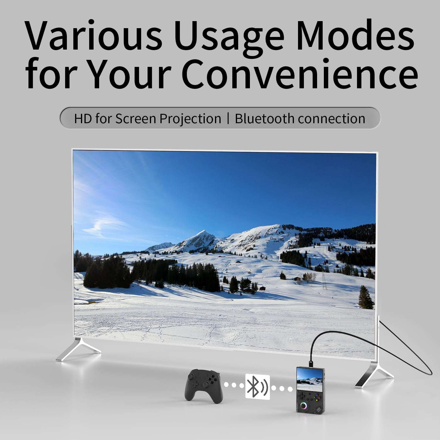 Een moderne tv toont een besneeuwd berglandschap. Een gamecontroller en handheld apparaat liggen ernaast.