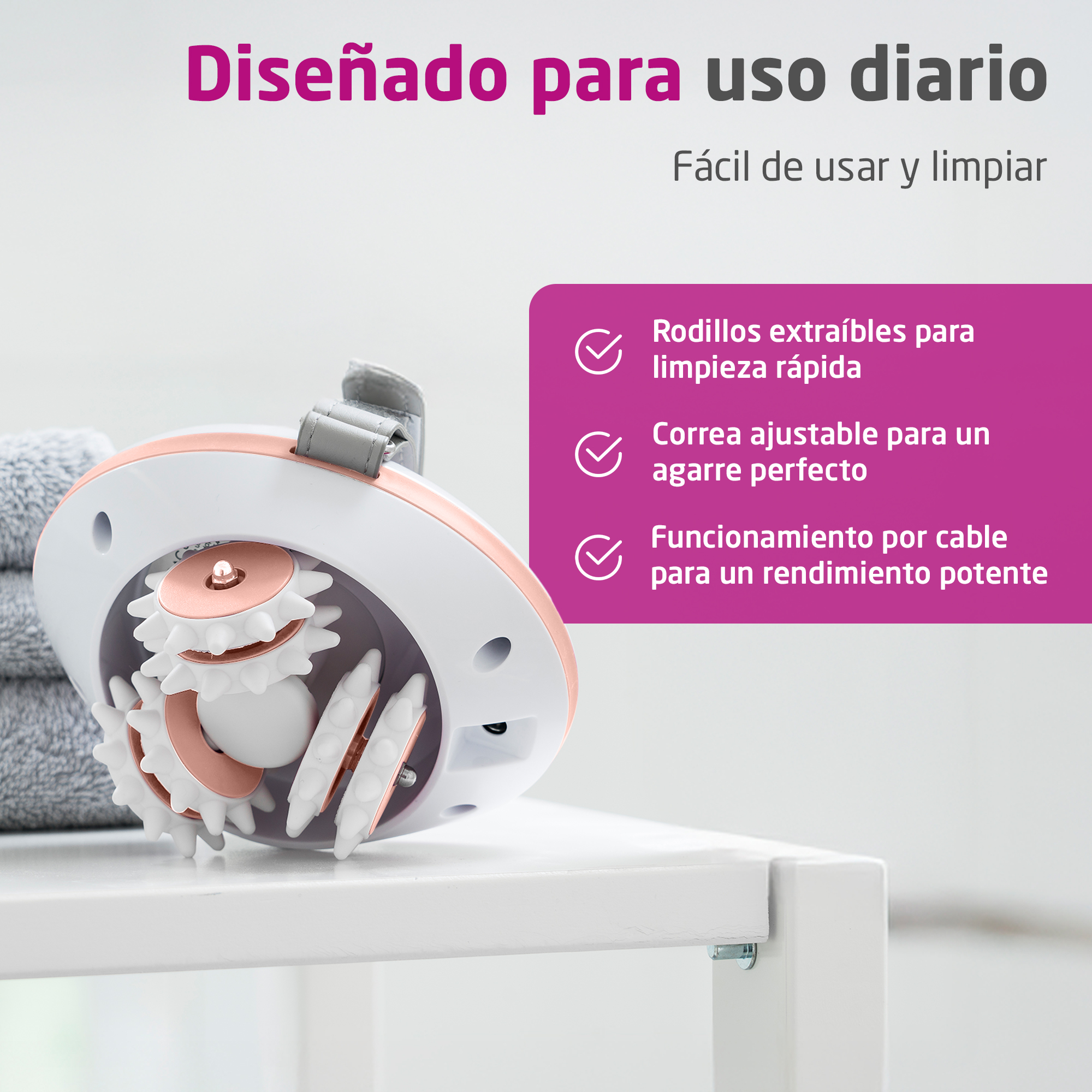 A white massager with pink accents and rotating rollers on a shelf.