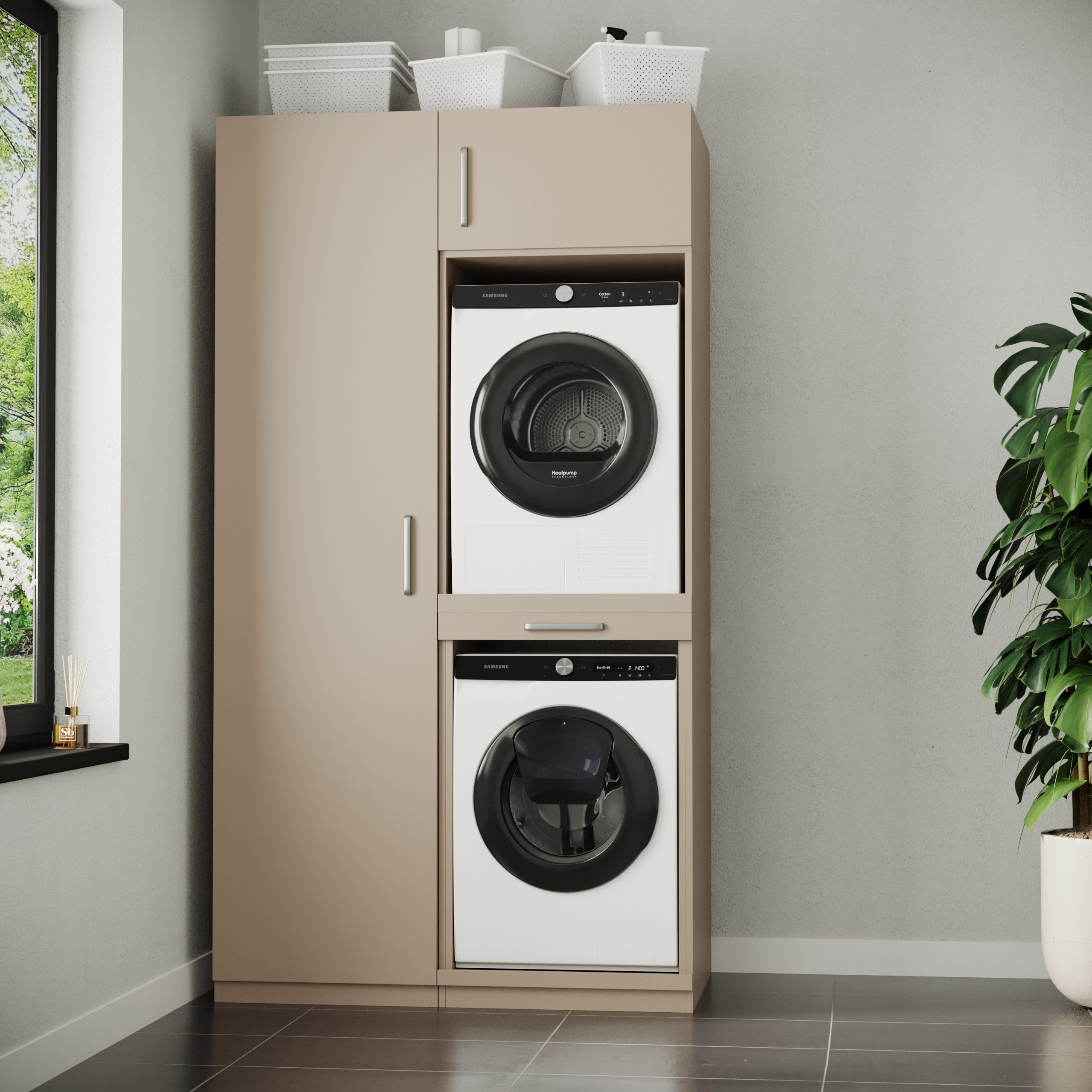 Ein beigefarbener Schrank mit Waschmaschine und Trockner. Oben Körbe.