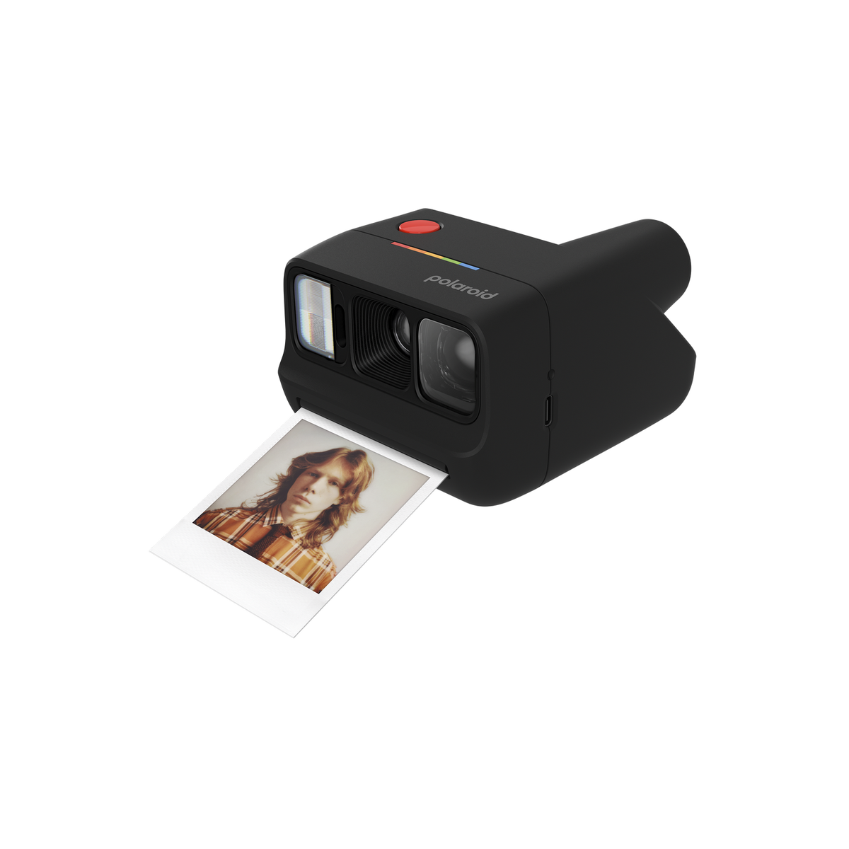 Fotocamera Polaroid nera con foto di una persona dai capelli lunghi.