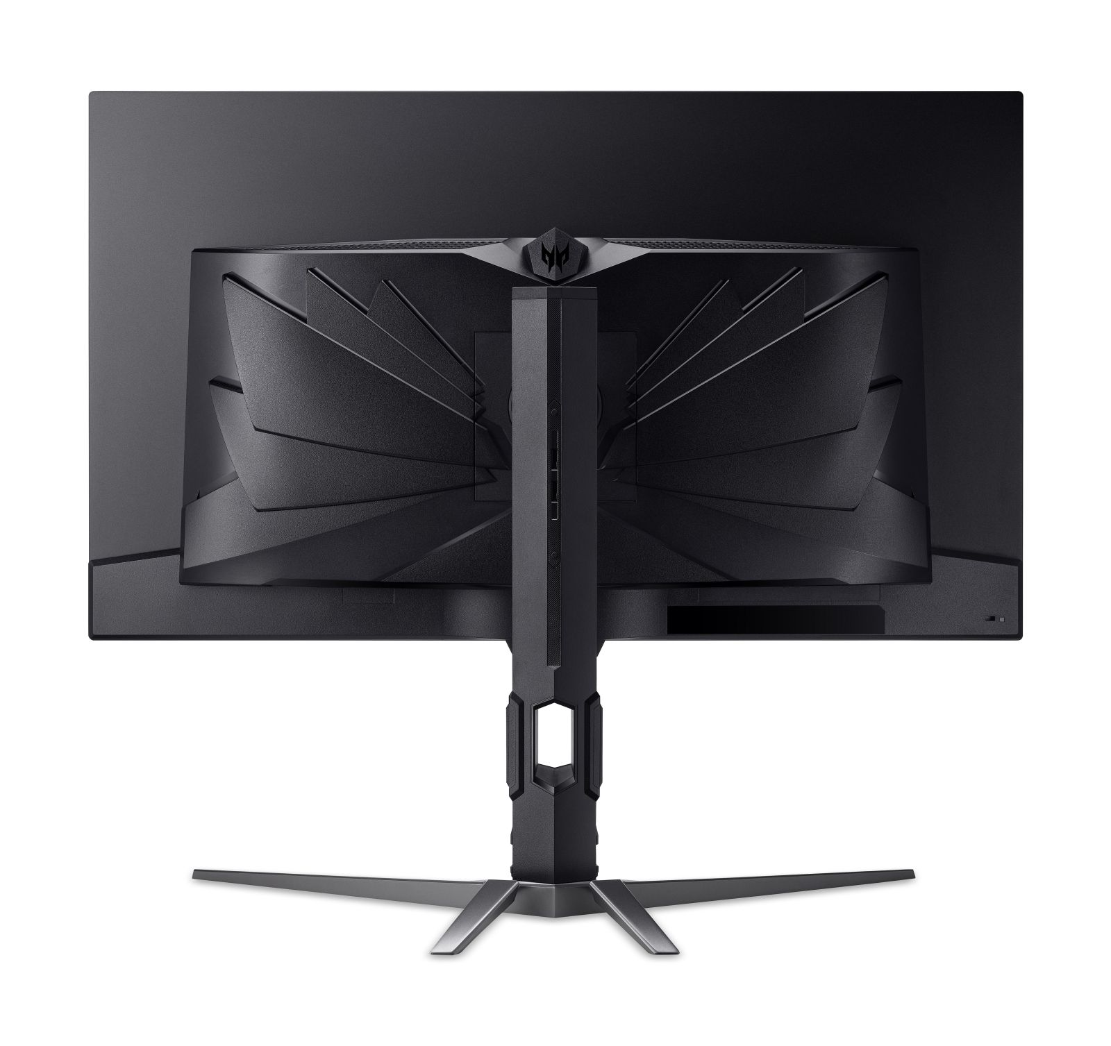 Vista trasera de un monitor negro con soporte de tres patas y diseño de patrón de ventilador.