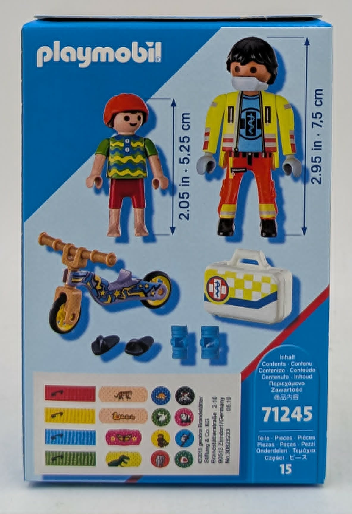 Playmobil-Verpackung mit zwei Figuren, Roller, Tasche und Aufklebern.