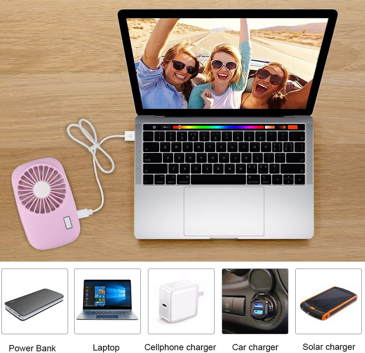 Ein Laptop mit drei lachenden Frauen im Freien. Daneben ein pinker Ventilator.
