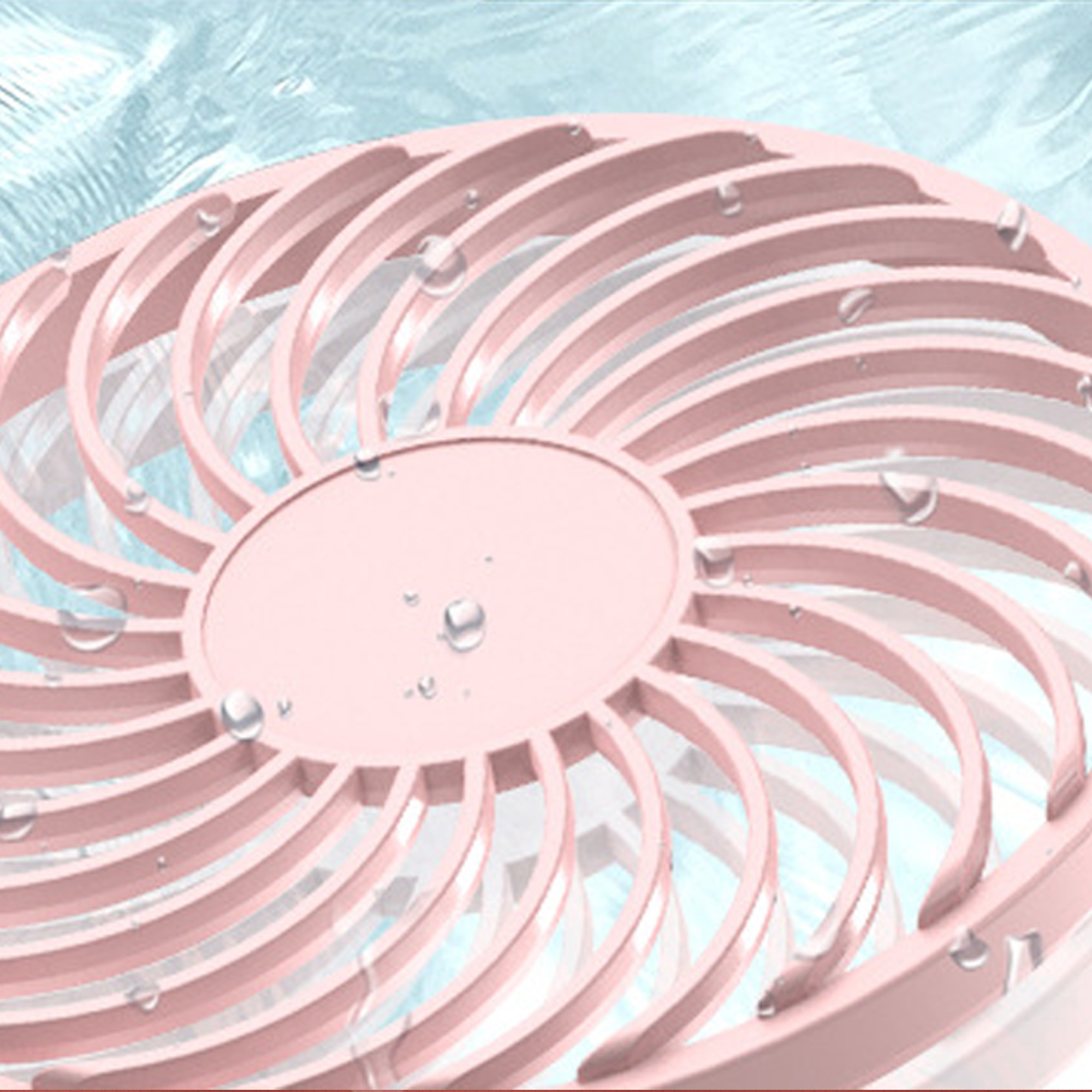 Ein rosafarbener Ventilator mit Wassertropfen vor blauem Hintergrund.