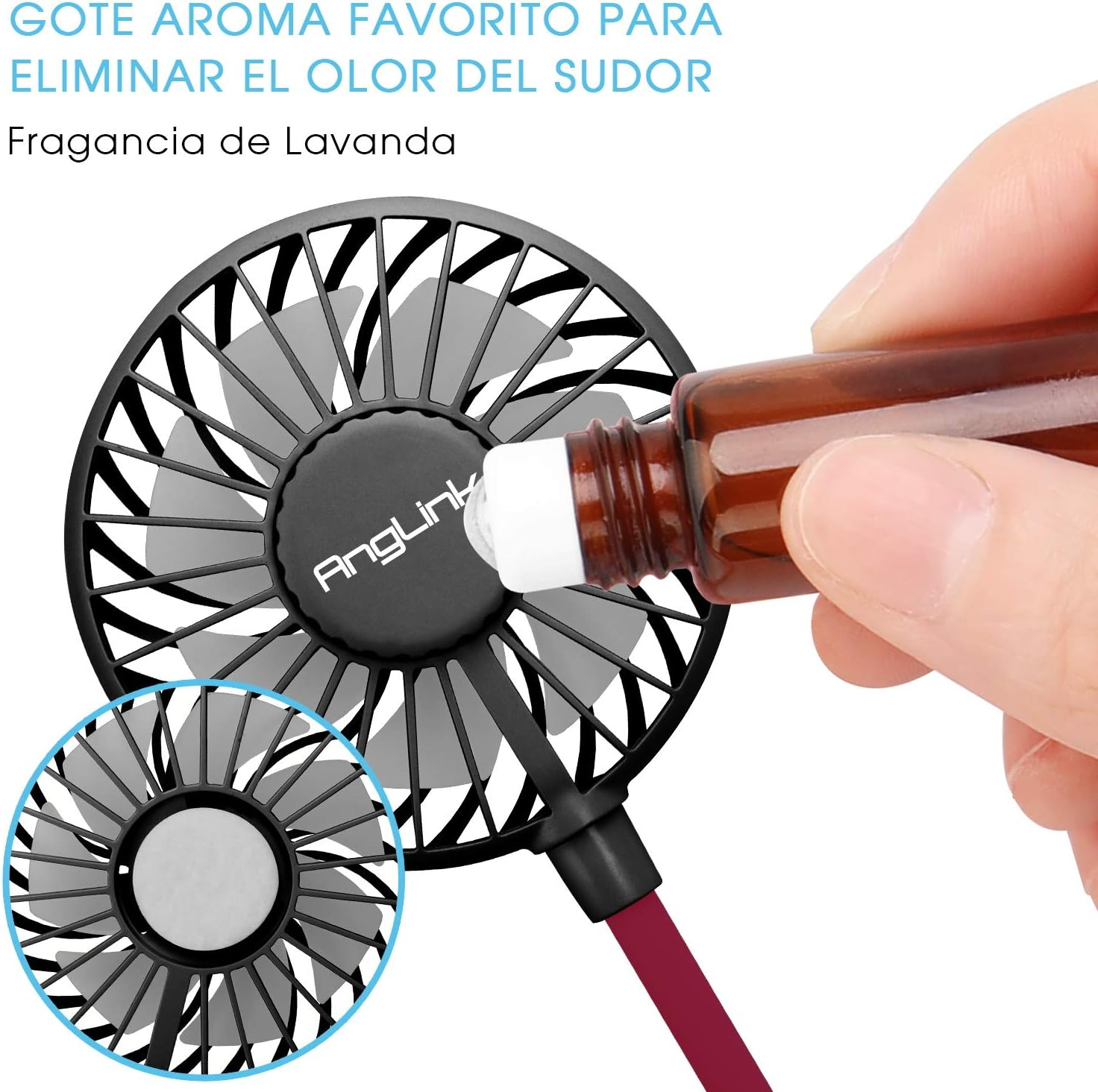 Hand tropft Aromaöl auf einen kleinen Ventilator mit Lüfterblättern.