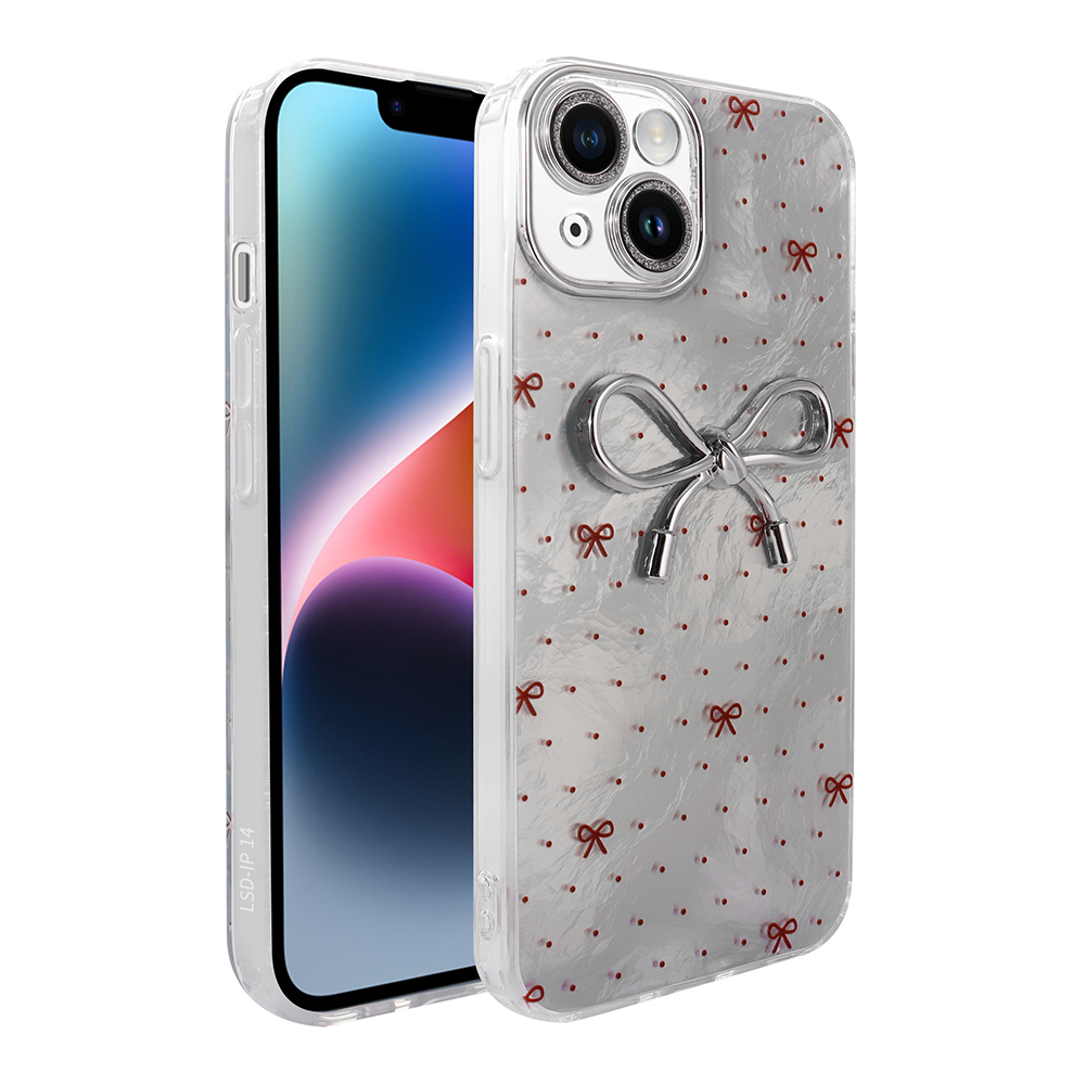 Küçük kırmızı fiyonklar ve büyük gümüş fiyonkla süslenmiş gümüş kasalı bir iPhone.