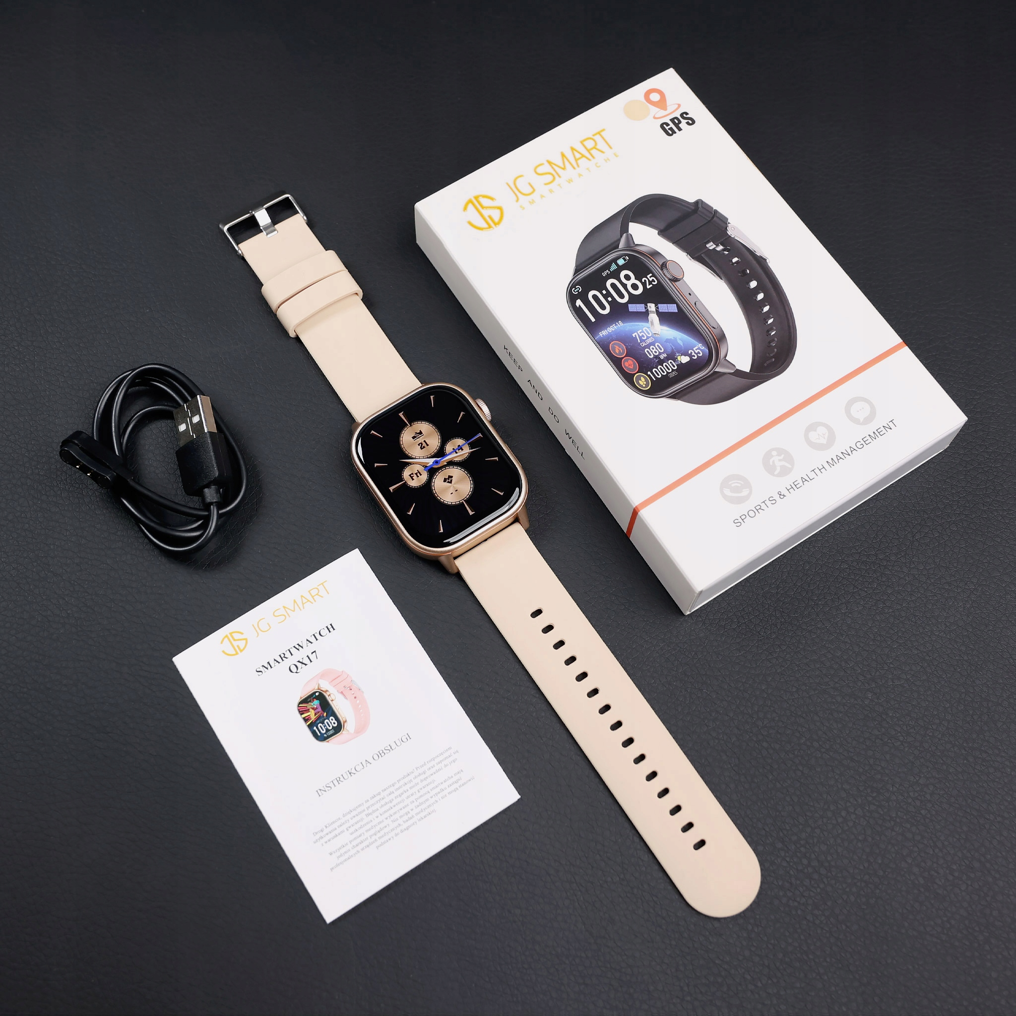 Zestaw smartwatch z beżowym paskiem, kablem do ładowania i instrukcją.