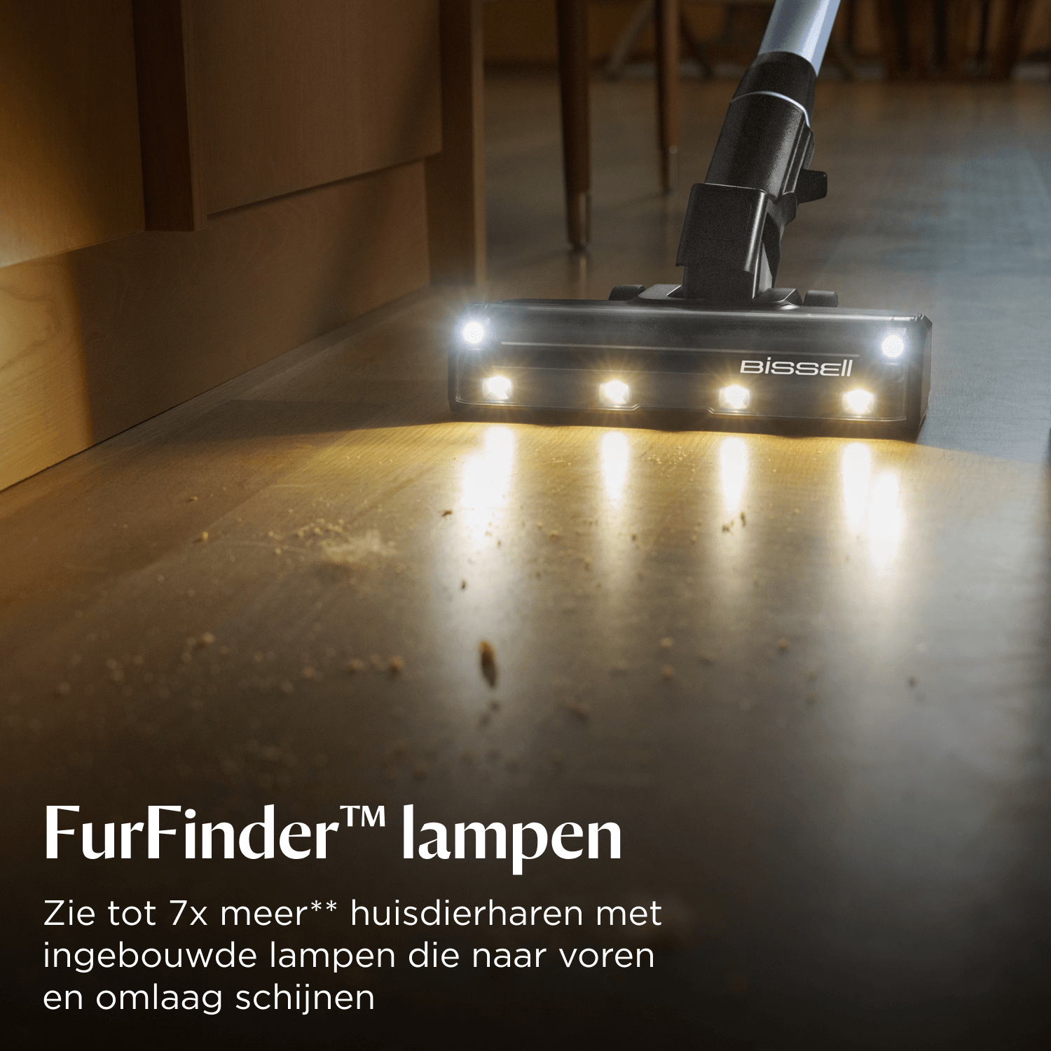 Bissell vacuum cleaner with lights cleans a wooden floor.