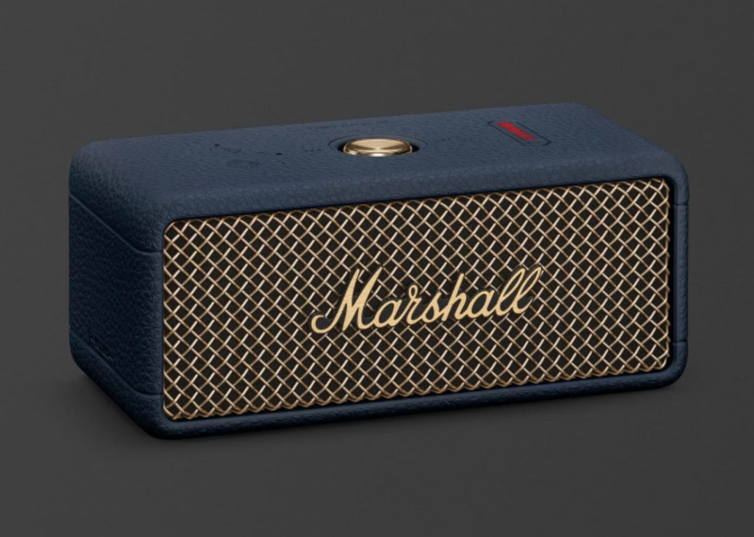Ein dunkelblauer Marshall-Lautsprecher mit goldener Front und goldenem Knopf.