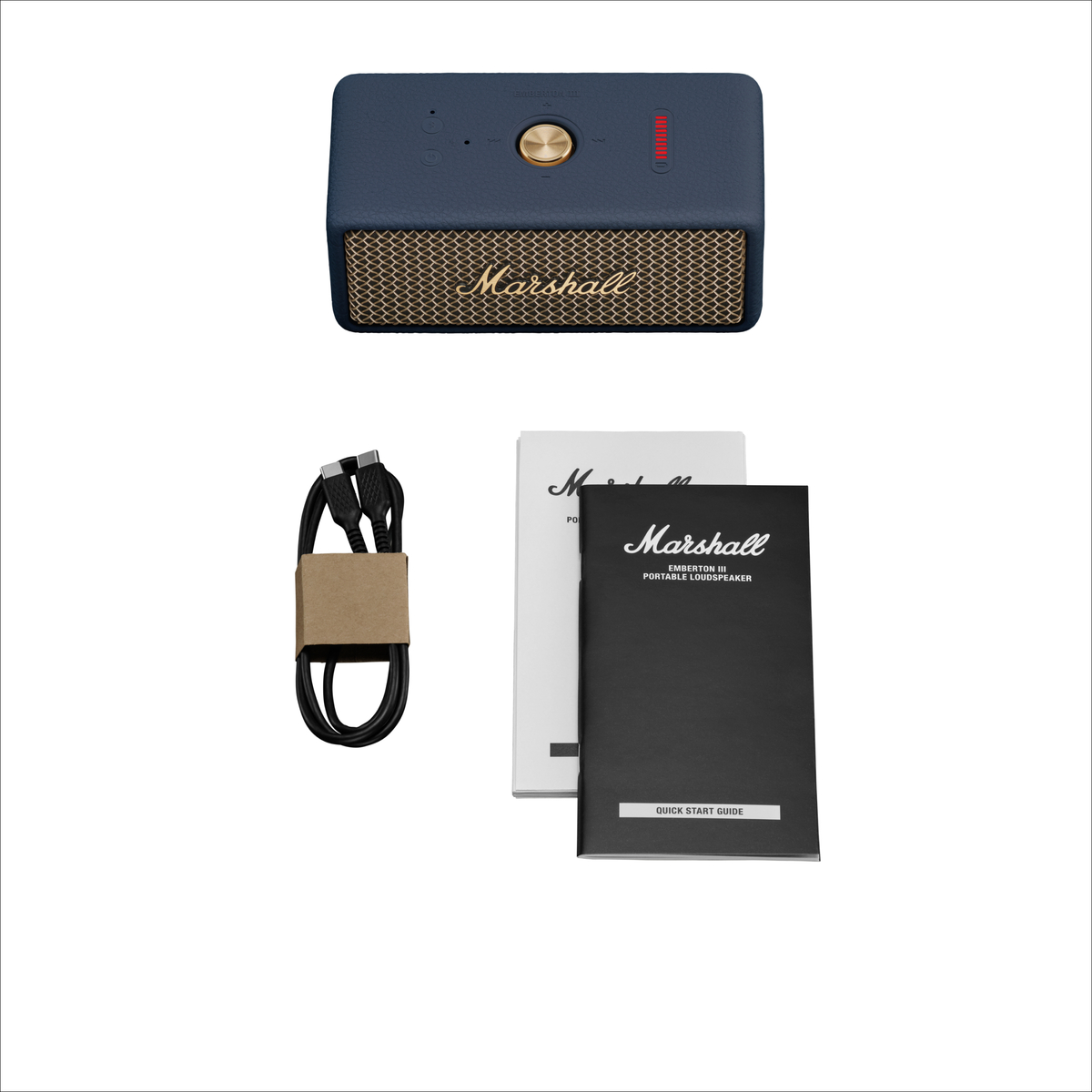 Ein Marshall Emberton III Lautsprecher, Ladekabel und Anleitungen.
