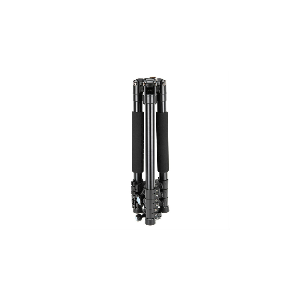 A folded black tripod with padded legs stands on a white background.